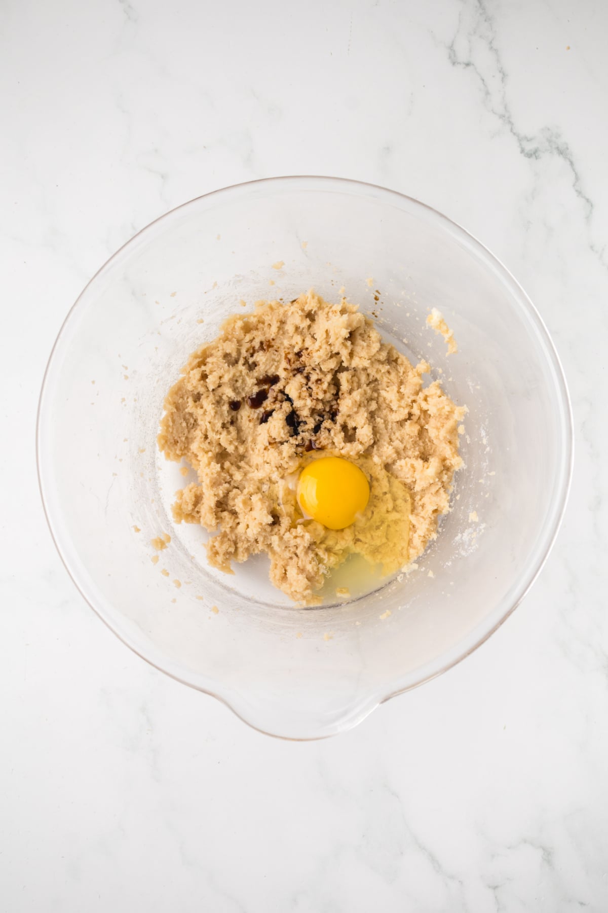 The eggs and vanilla extract combined with the sugar.