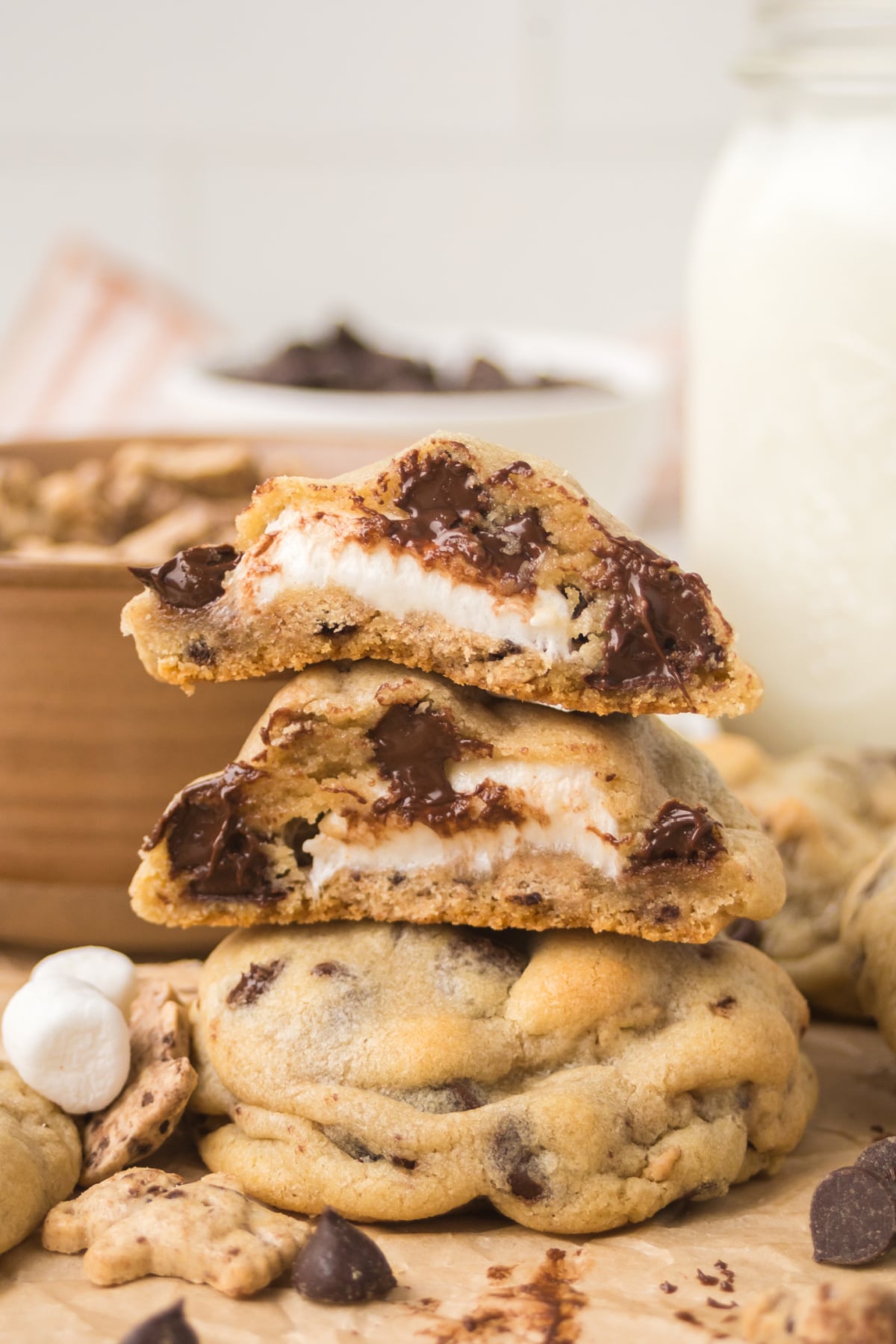 A cookie split open, showing the chocolate and marshmallow center.