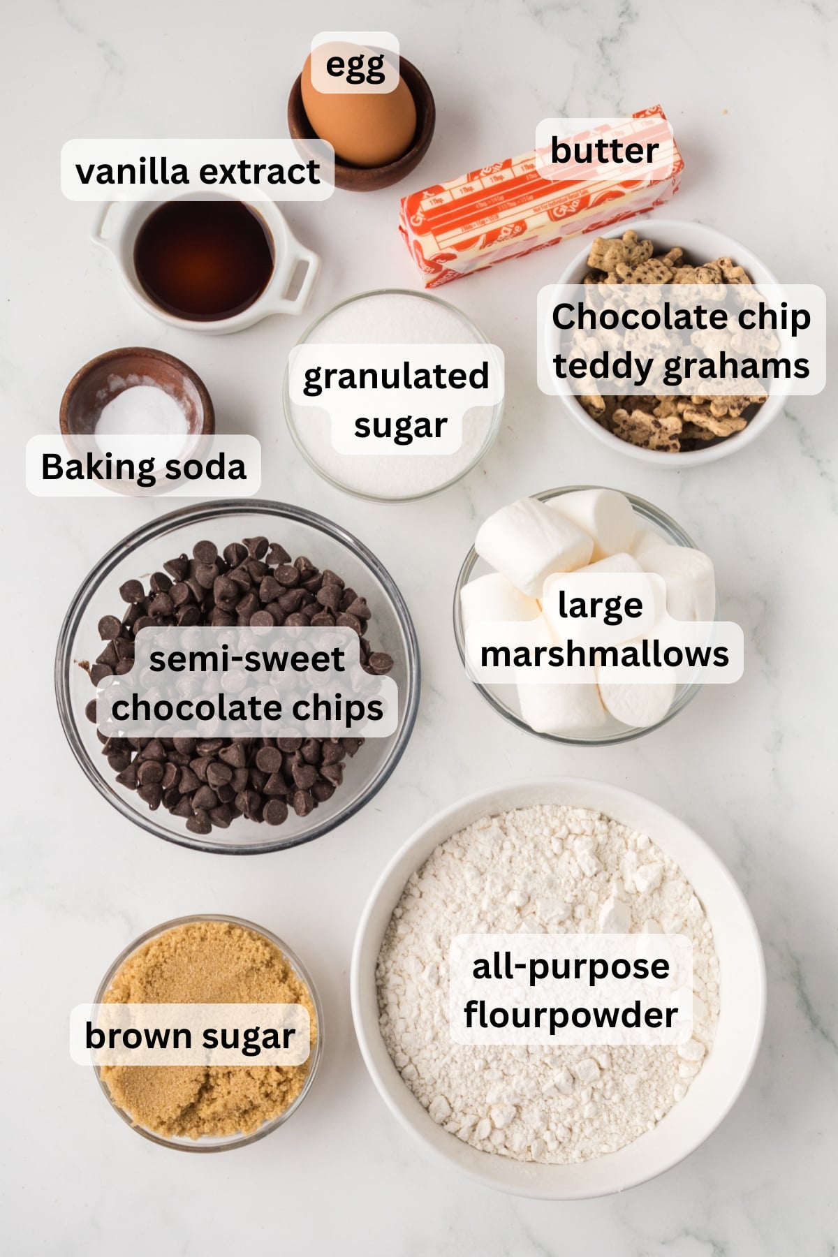 Ingredients to make these s'mores cookies in bowls on a table.