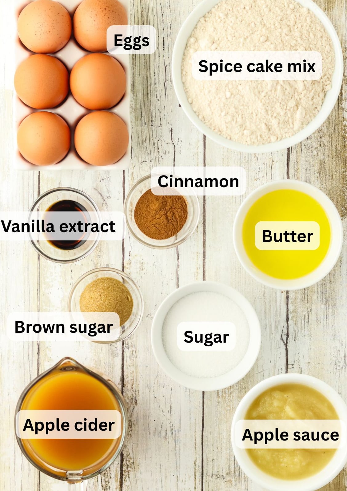All of the ingredients needed to make an Apple Cider Cake Recipe on a table.