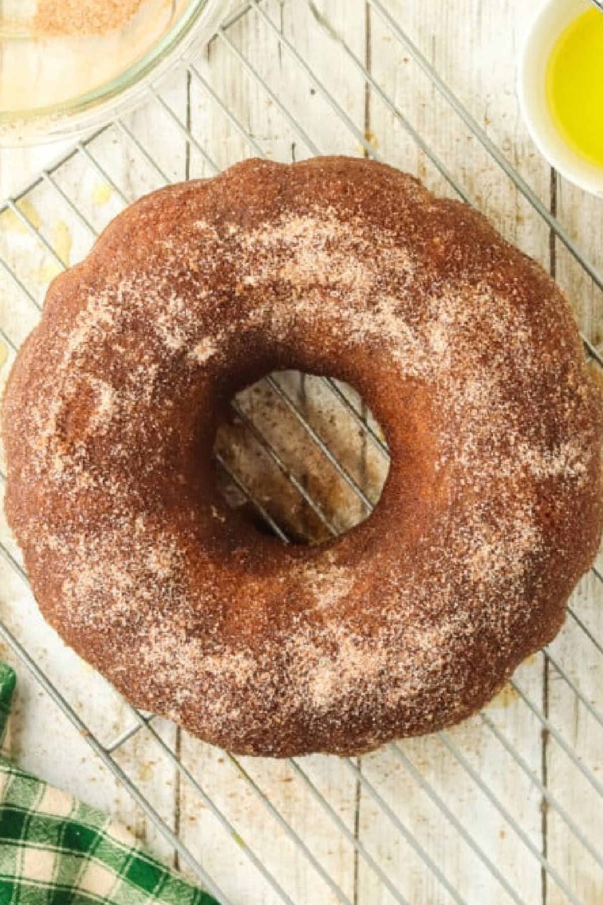 Cinnamon sugar topping sprinkled all over warm bundt cake.