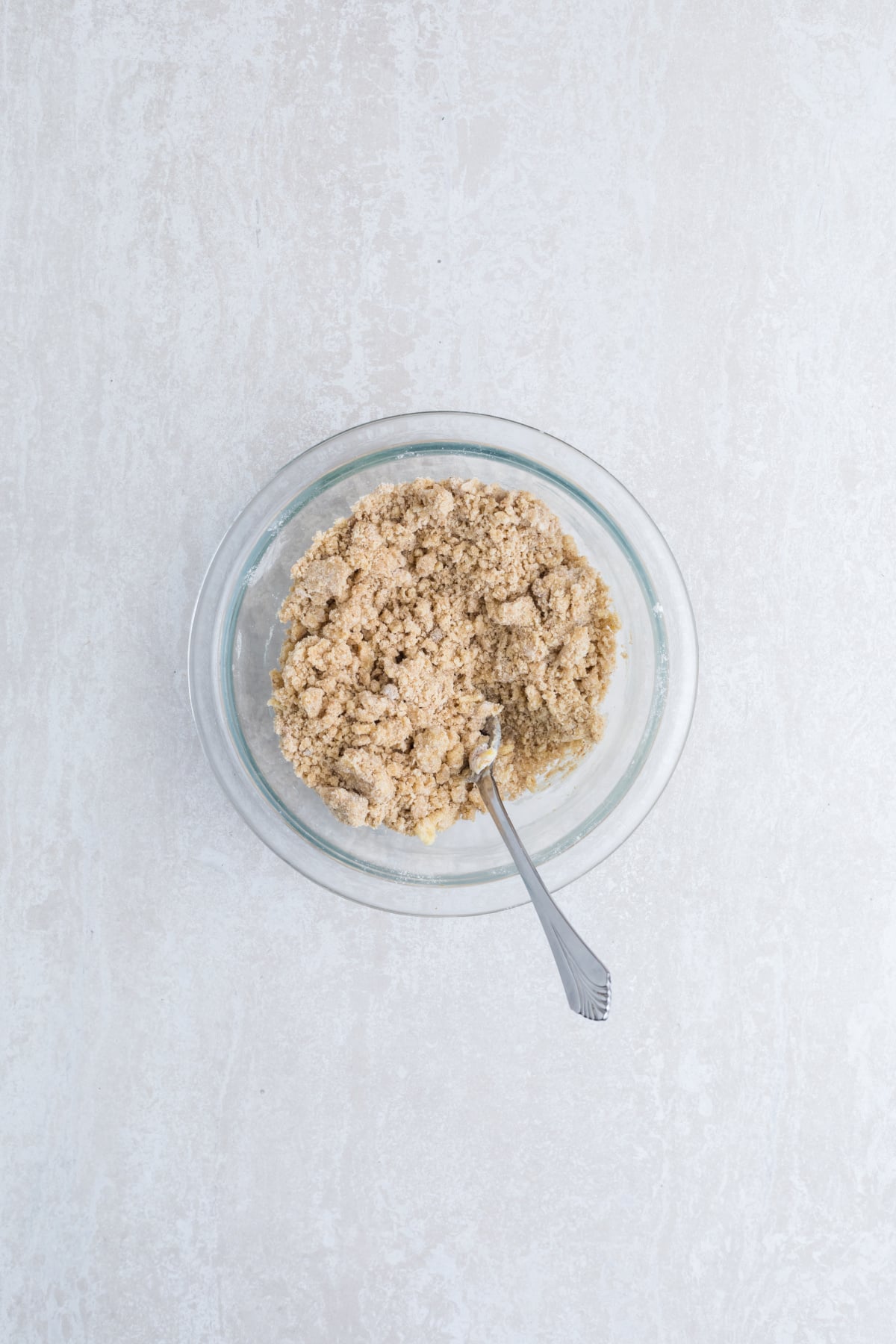 Crumb topping ingredients mixed together in a bowl.
