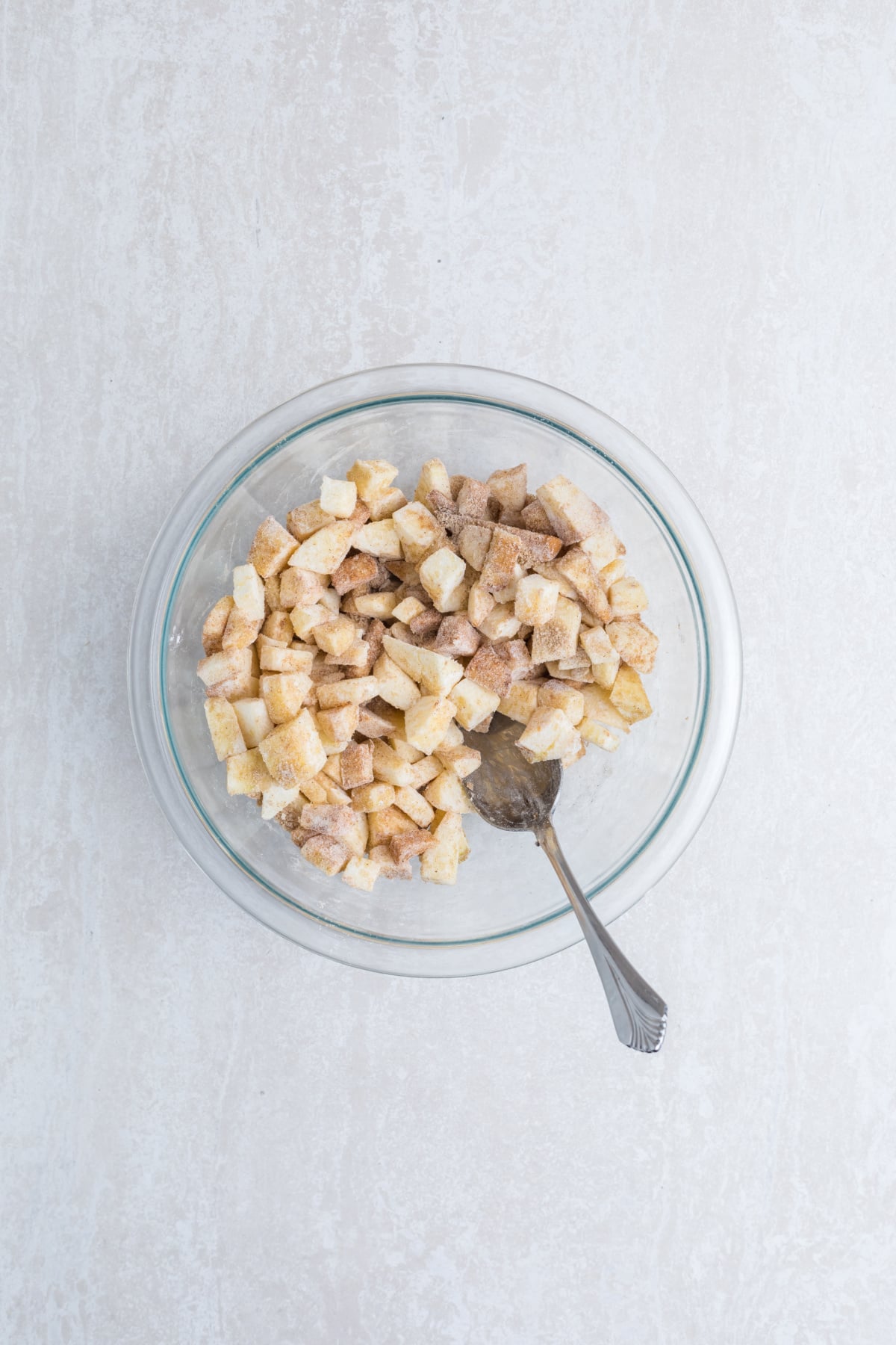 Cinnamon apple filling mixed in a bowl.