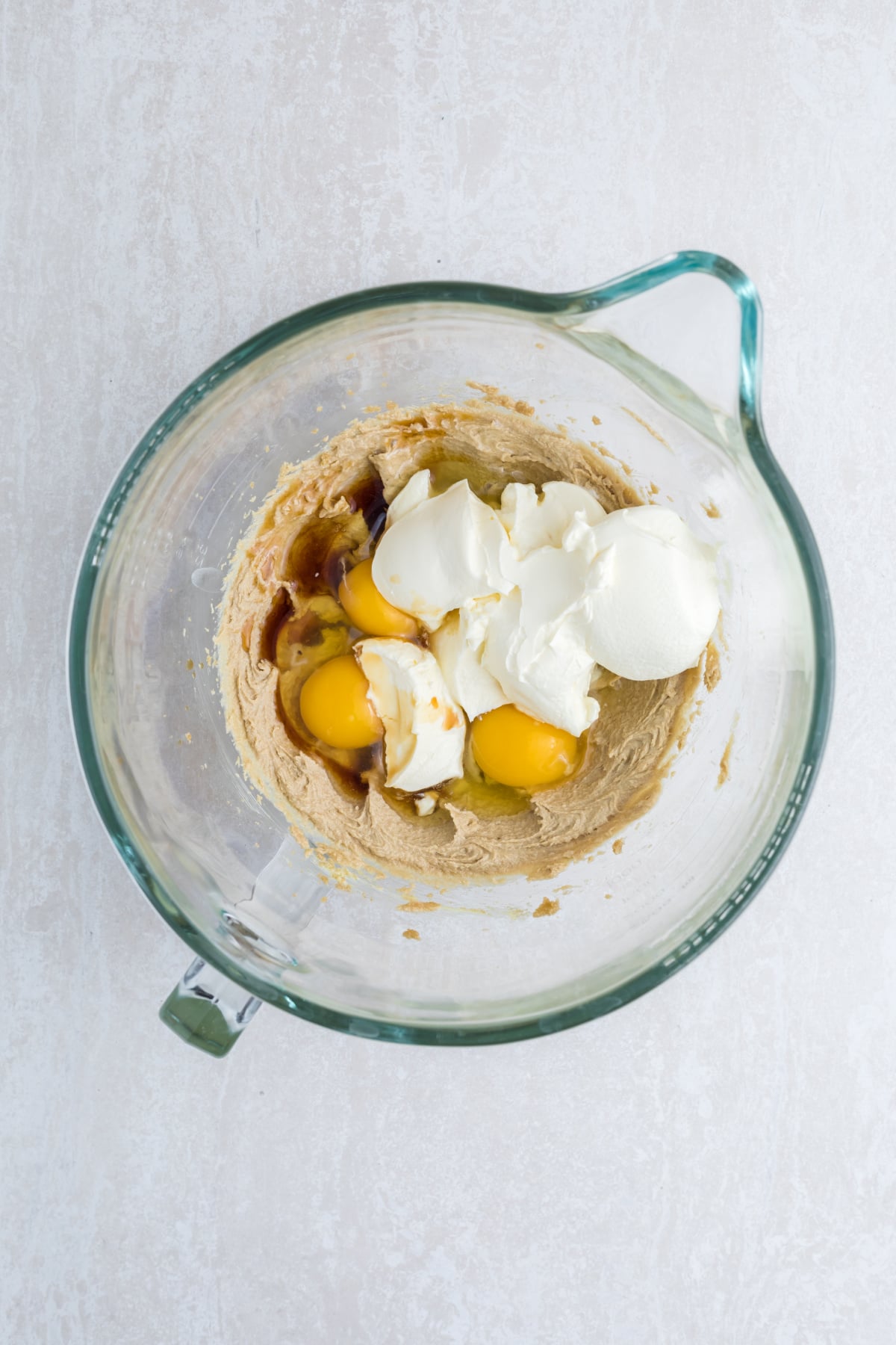 The wet ingredients for cake batter in a bowl.