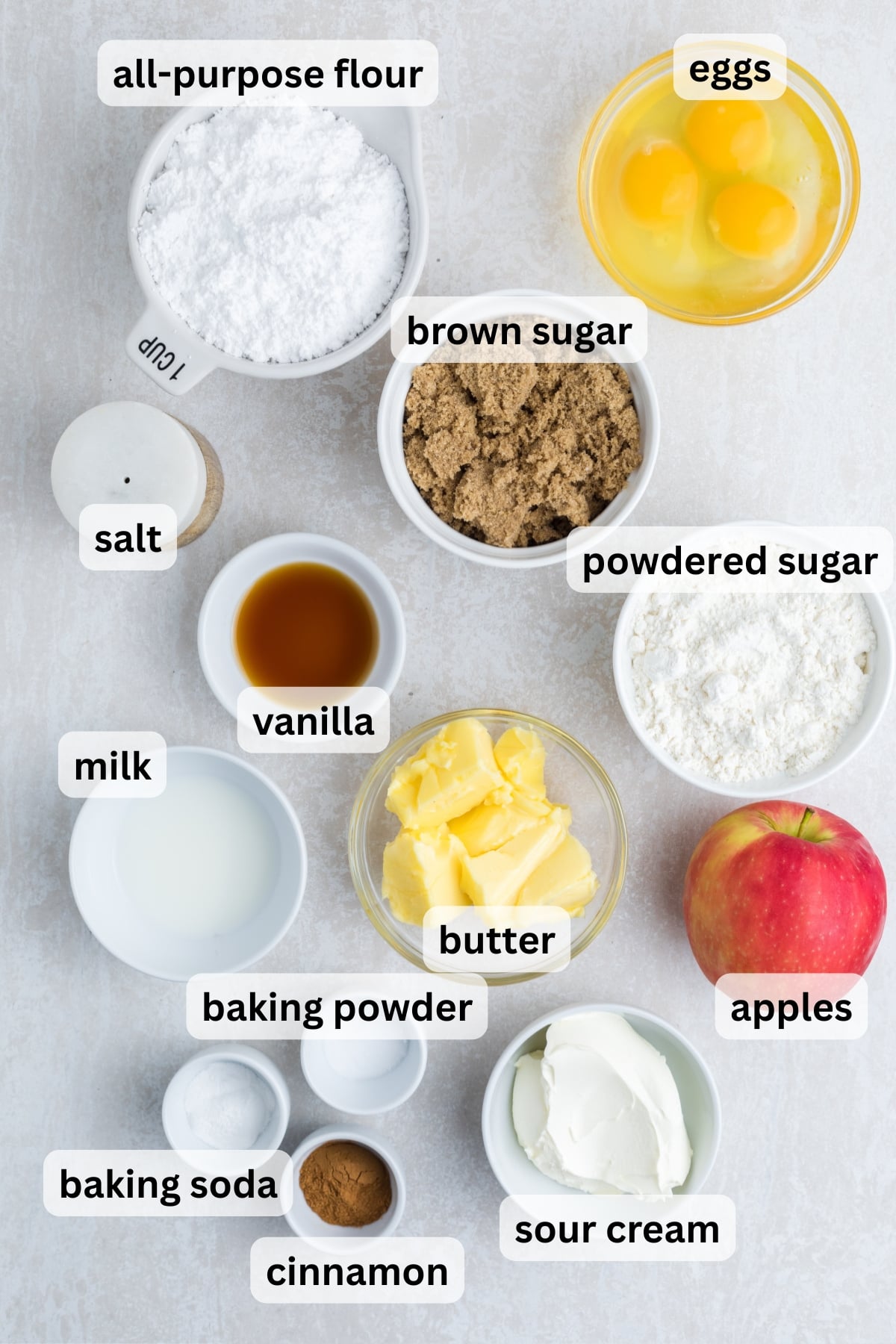 All of the ingredients needed to make Apple Cinnamon Coffee Cake in bowls on a table.