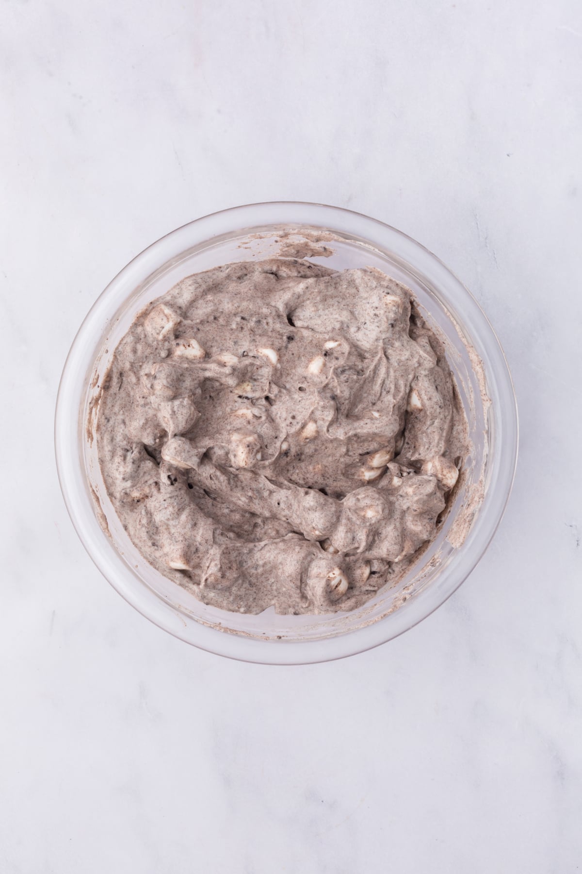 blended fluff ready for serving with a few marshmallows and chopped cookie garnishes.