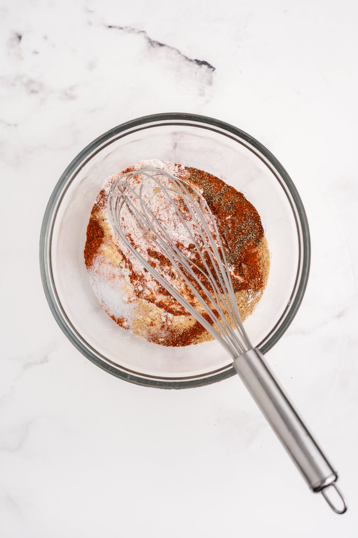 Baking powder, flour, and spices to a mixing bowl.