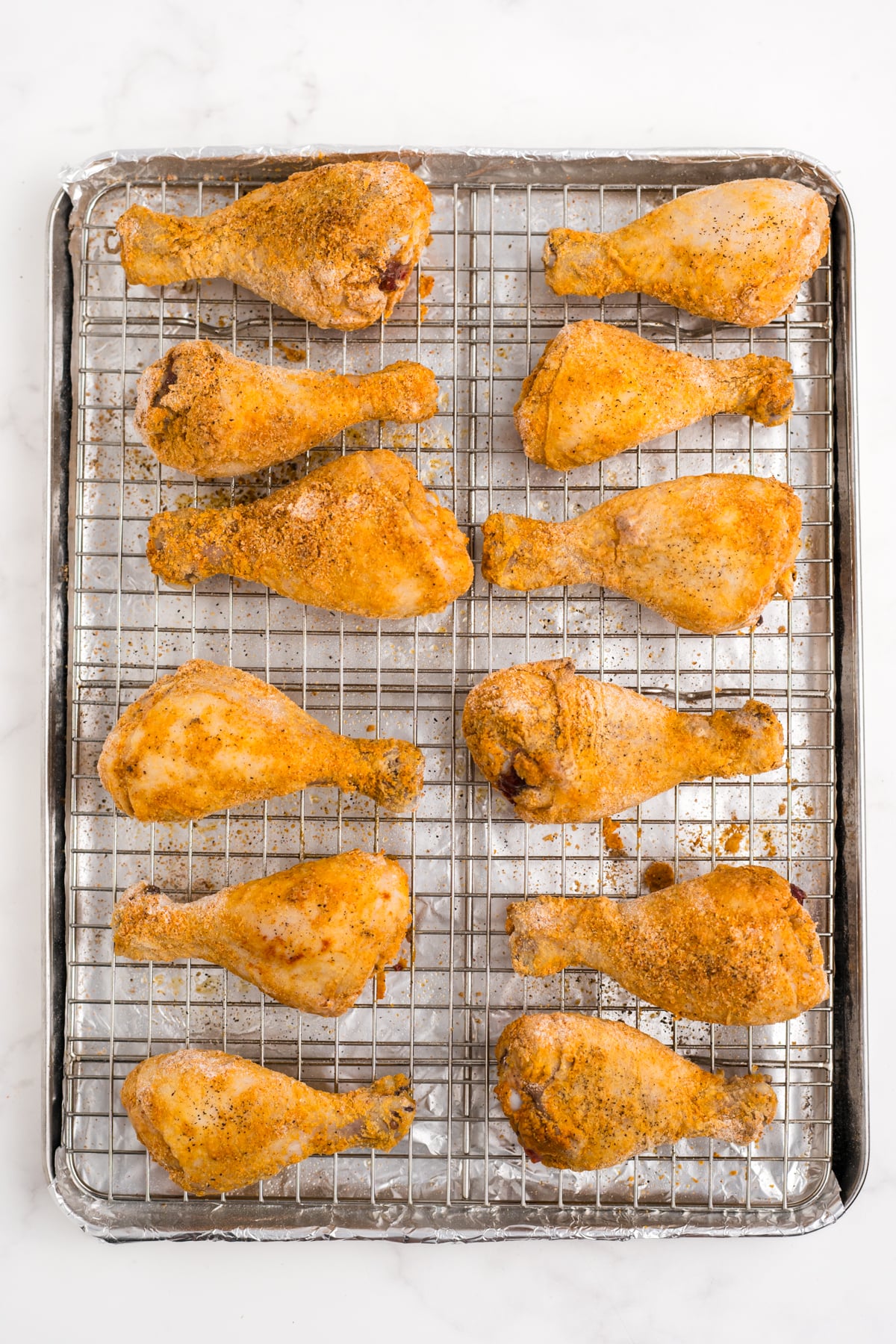 The chicken cooked and cooling on a wire rack.