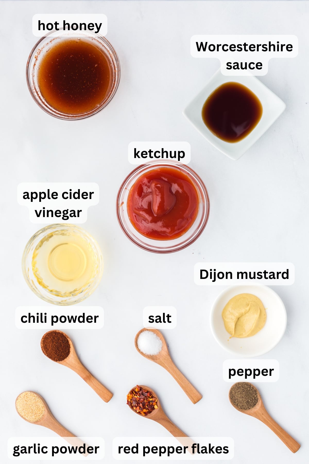 Ingredients for homemade hot honey BBQ sauce arranged on a countertop.