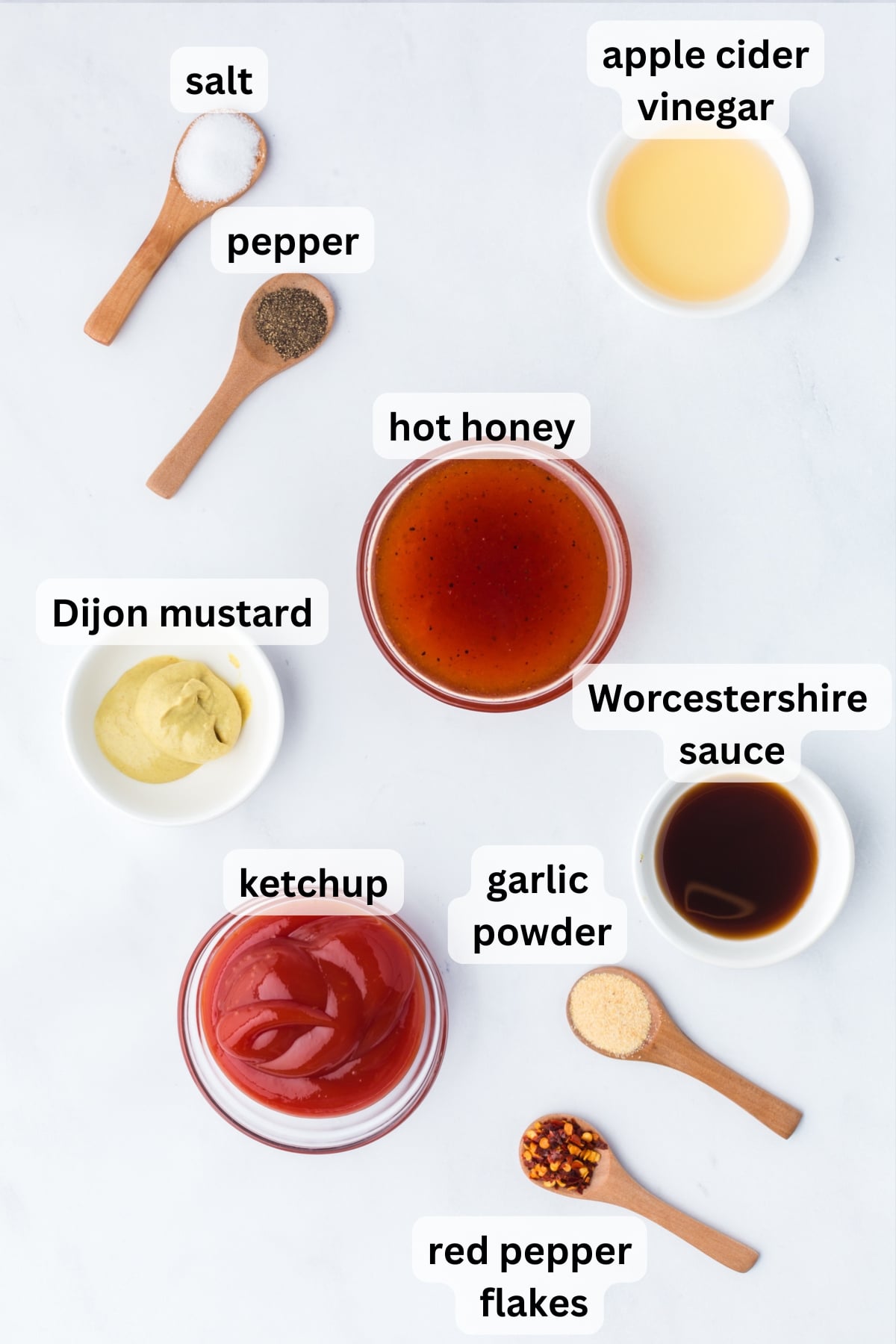 Ingredients for homemade hot honey BBQ sauce arranged on a countertop.