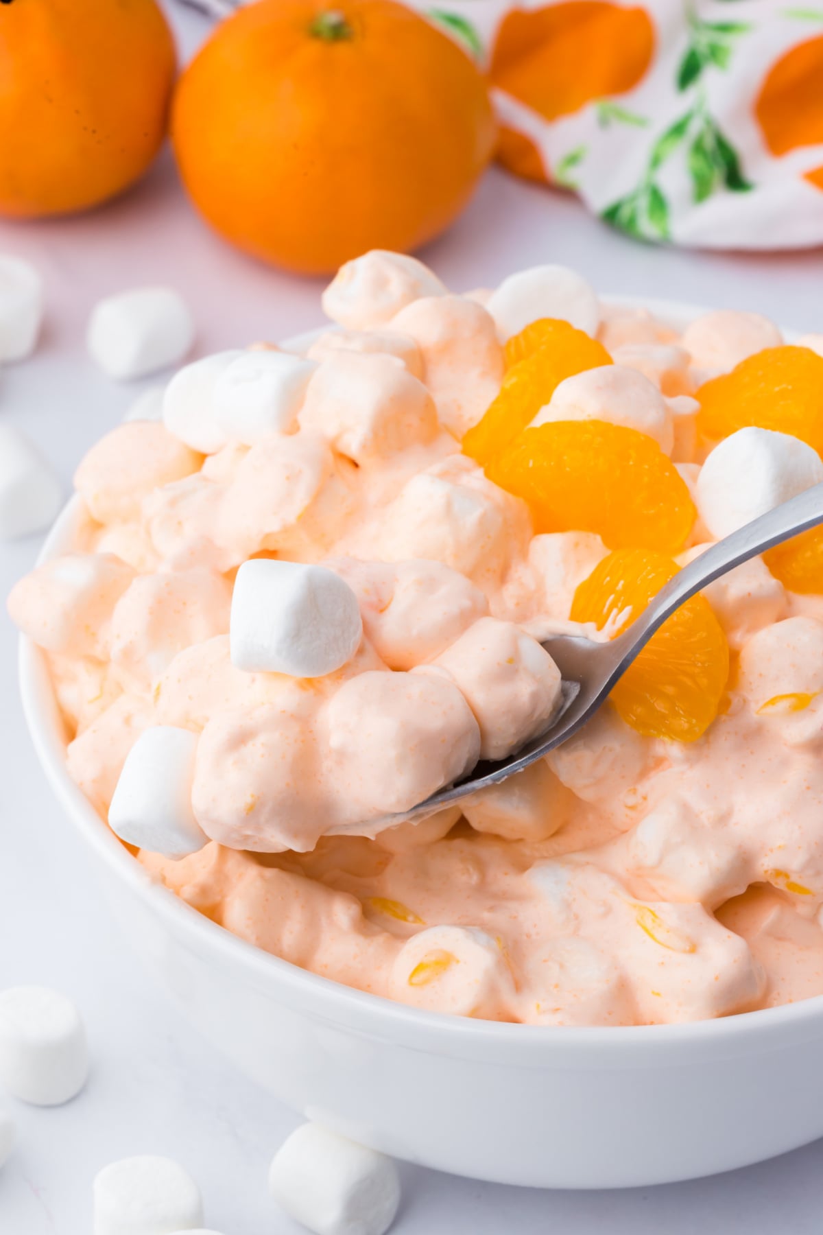A spoonful of fluff being lifted out of a bowlful.