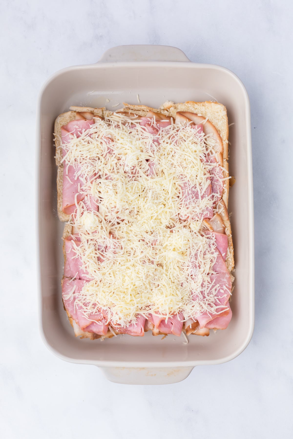 Turkey, ham, and Swiss cheese layered on toasted slider rolls.