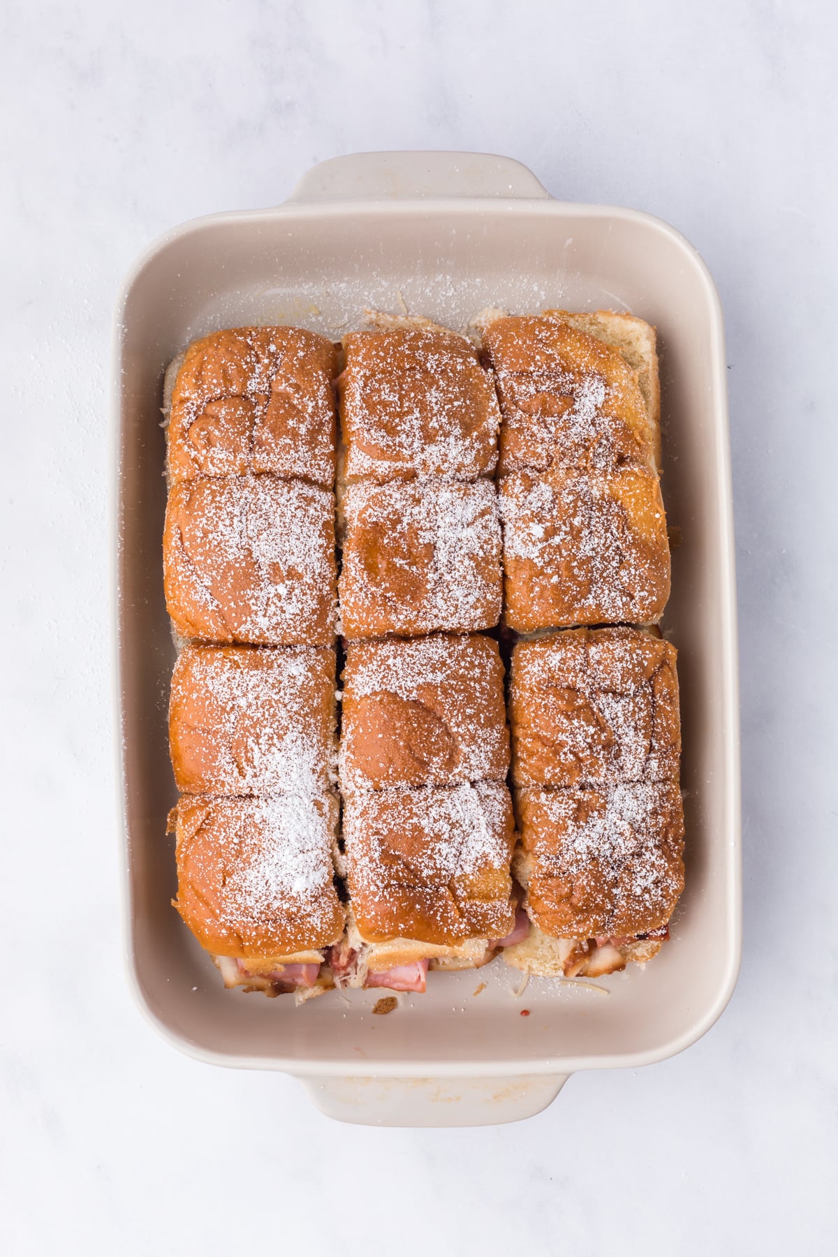 Baked Sliders dusted with powdered sugar before serving.