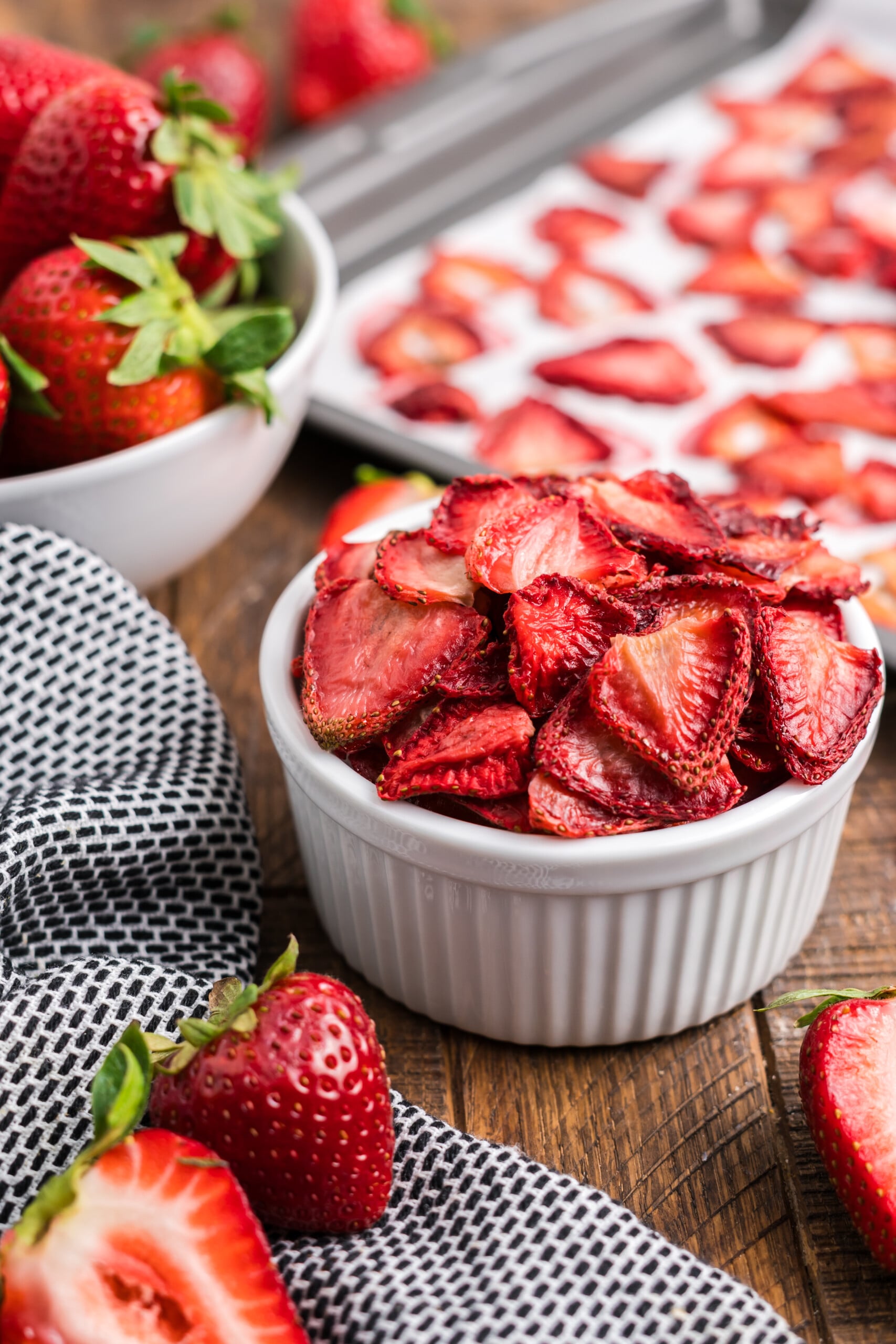 A ramekin filled with roasted strawberries.