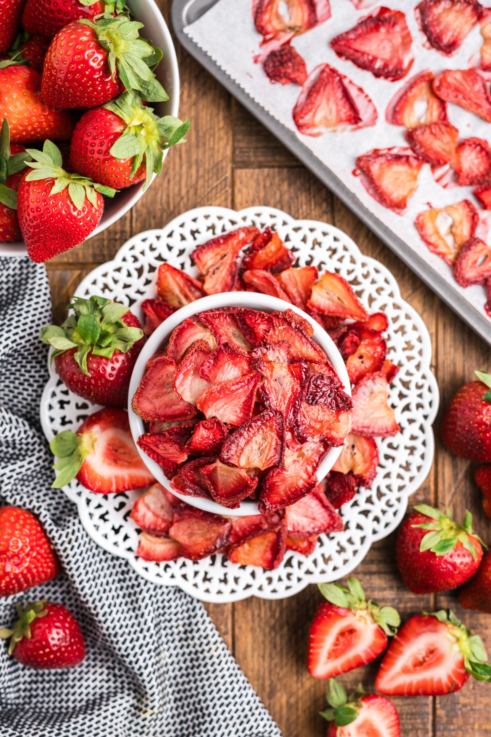 A dish with baked strawberries on a table.