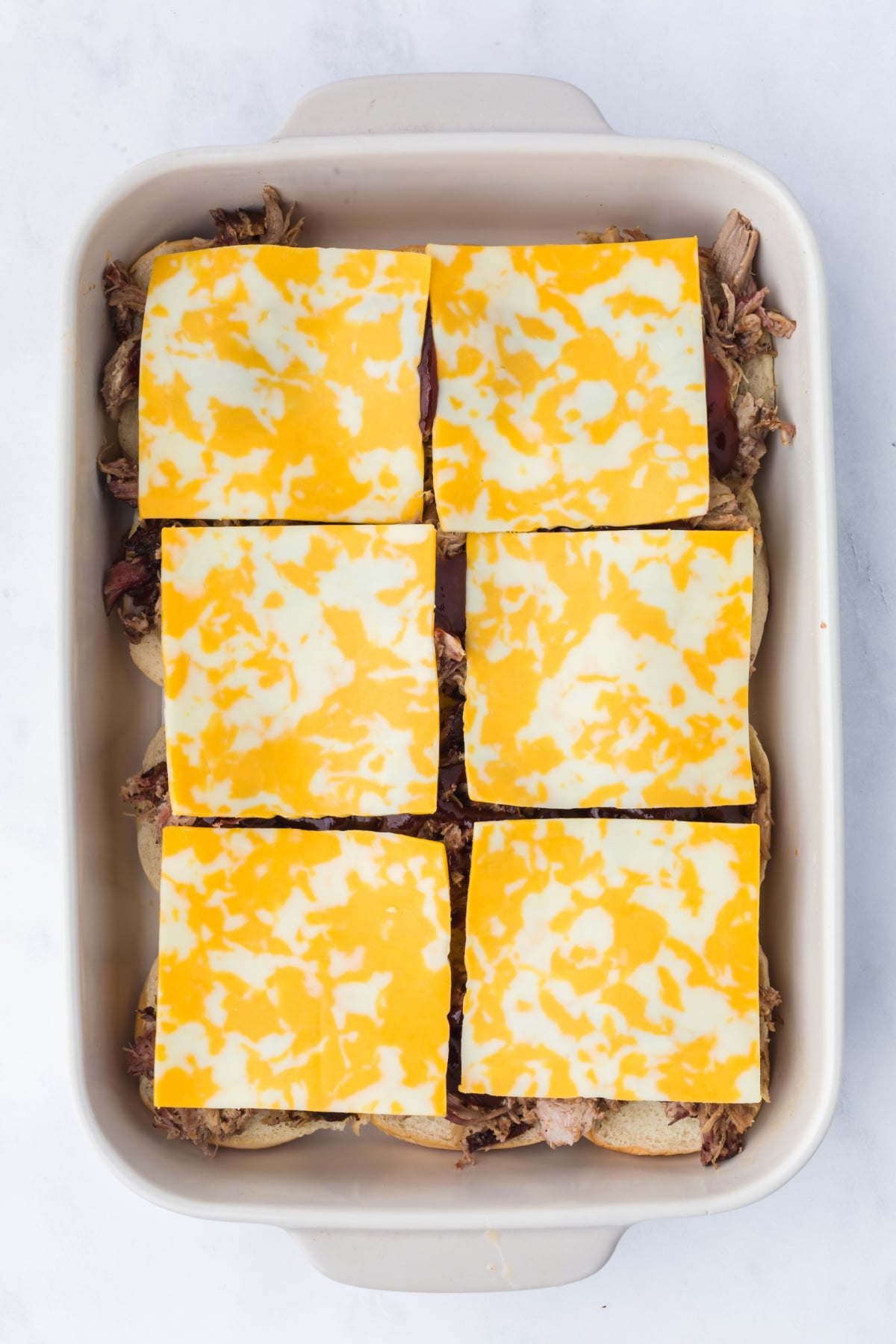 Cheese topped sliders.