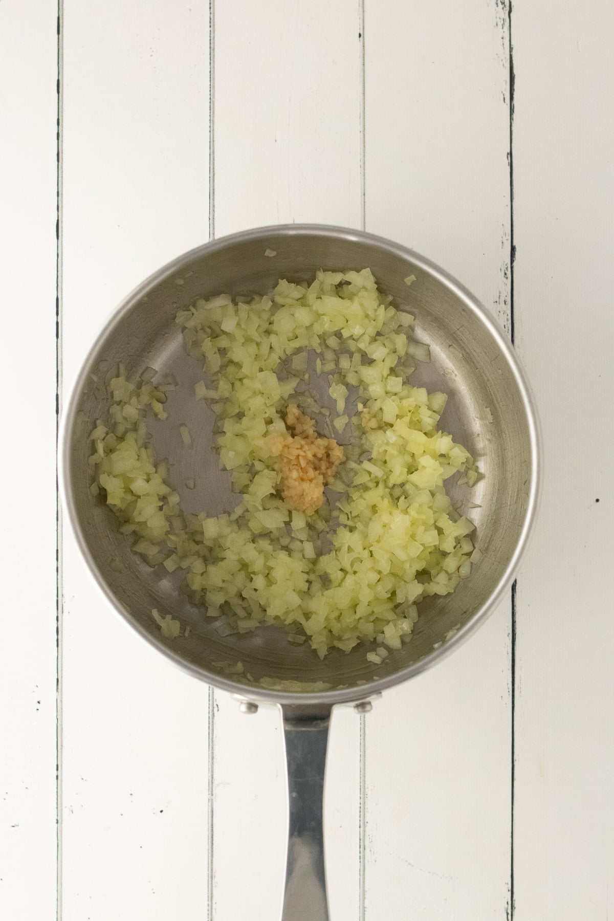 Softened onions and garlic in pan.