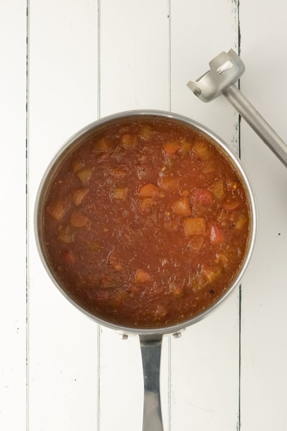 Chunky sauce in pot before blending.