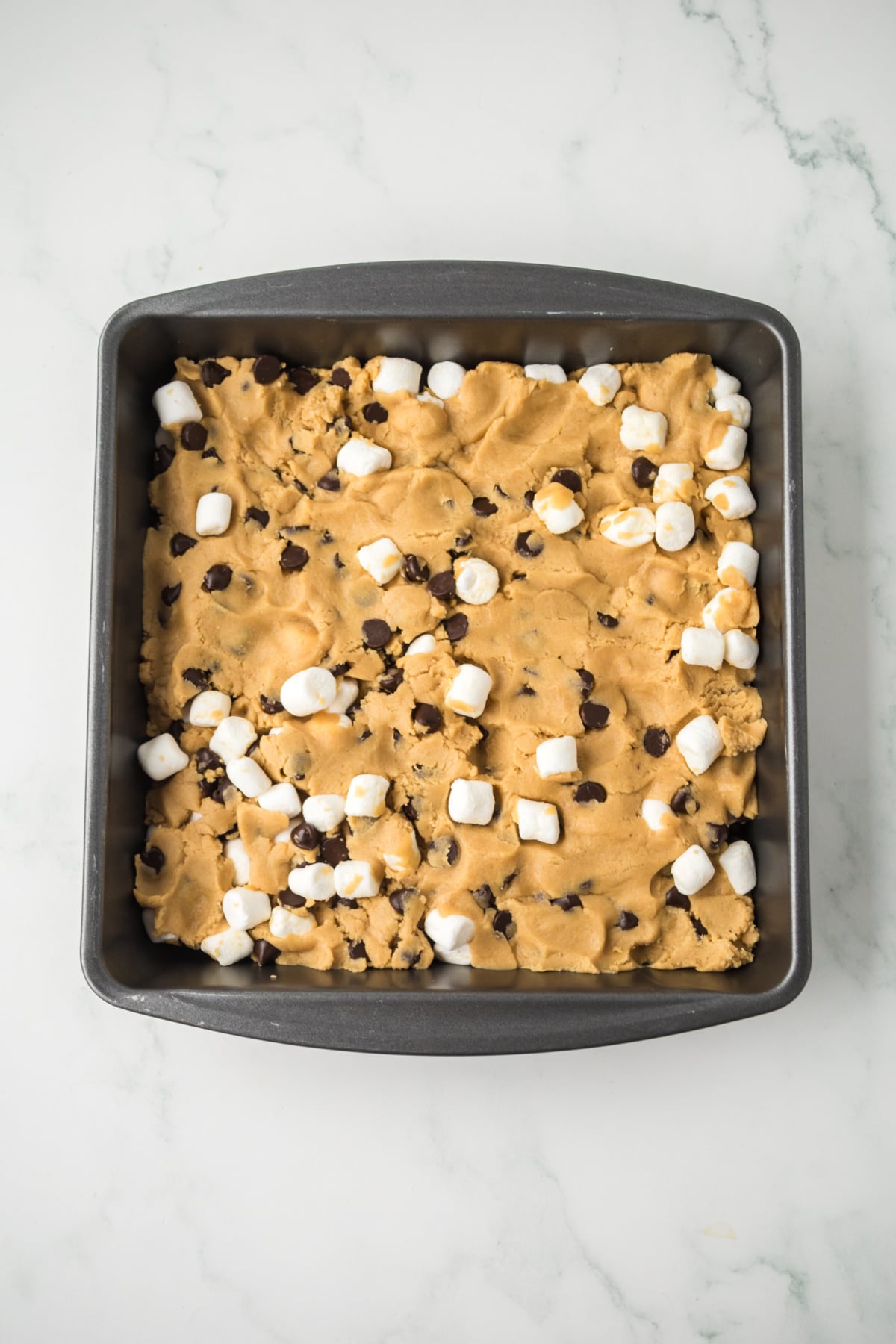 dough spread evenly in a prepared baking dish.