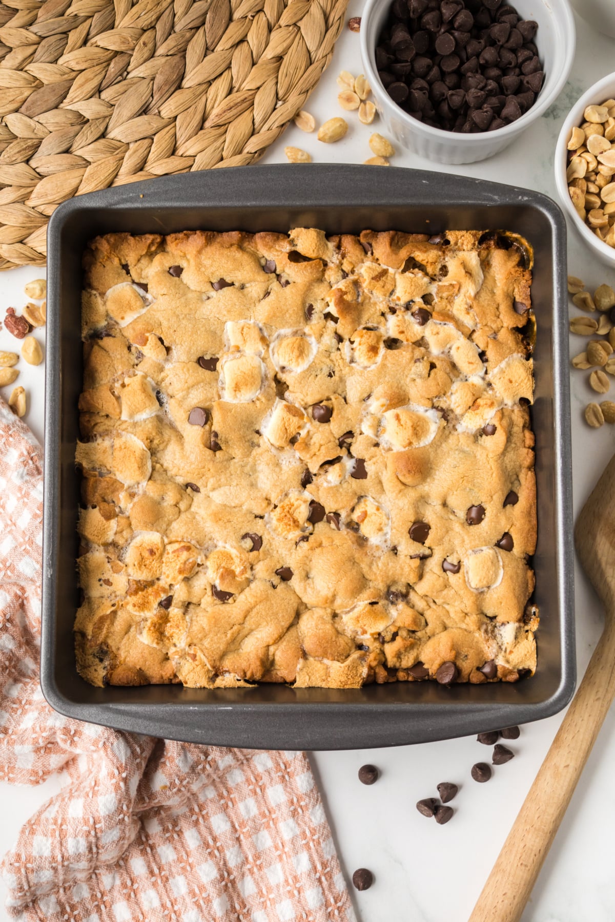Freshly baked s'mores cookie bars cooling in a baking pan.