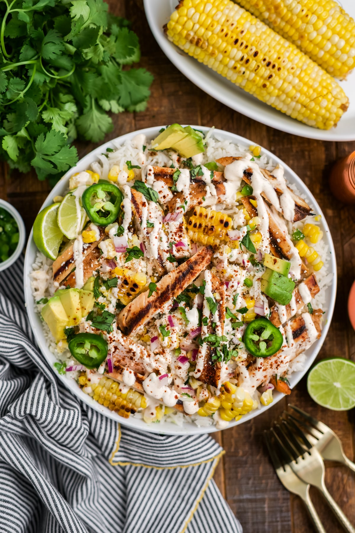 Bowl topped with creamy dressing, cotija cheese, and fresh cilantro.