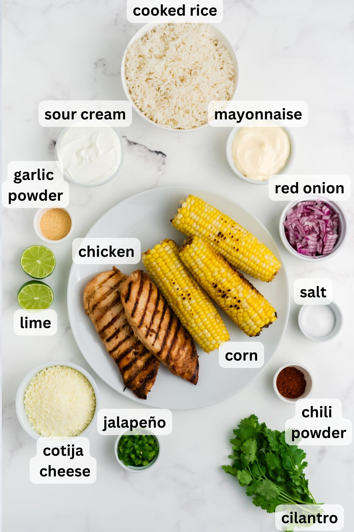 Ingredients for Street Corn Chicken Rice Bowls arranged on a table.