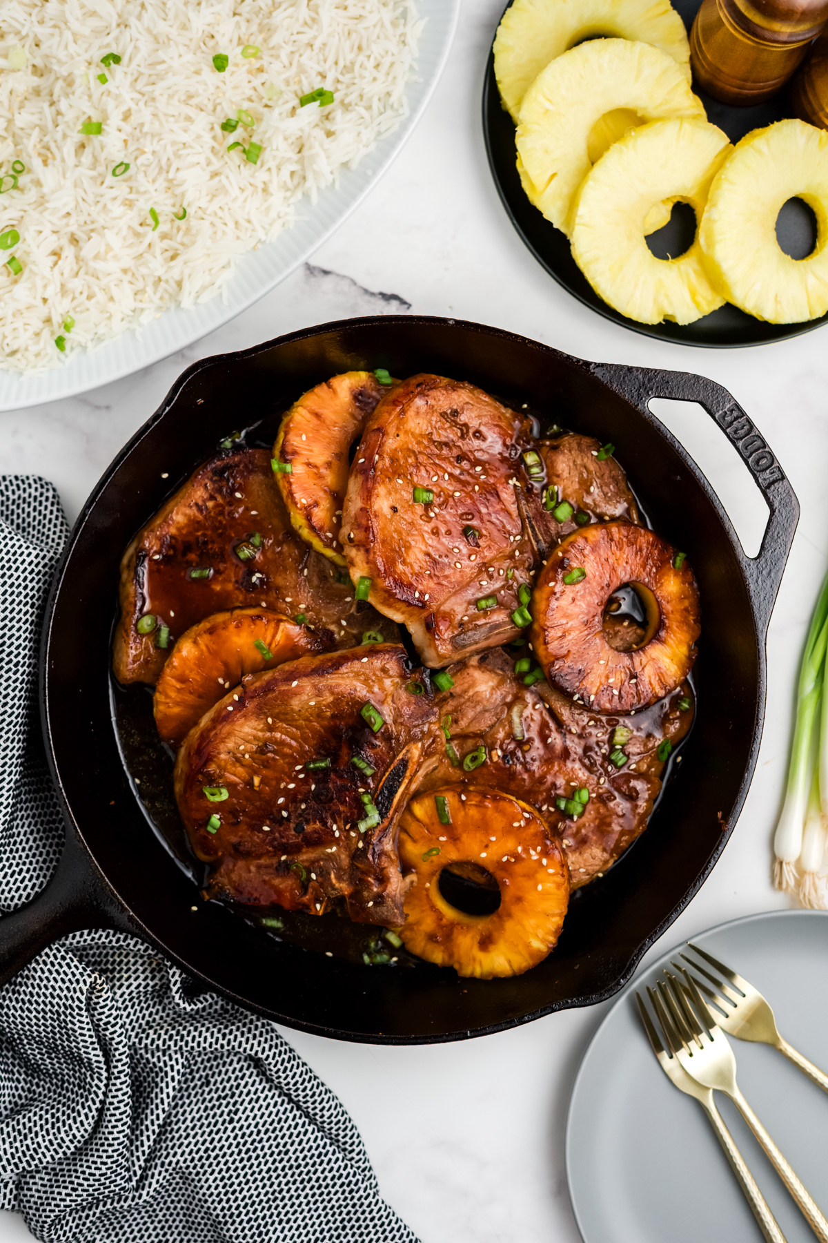 The pork chops and pineappples added back into the pan.