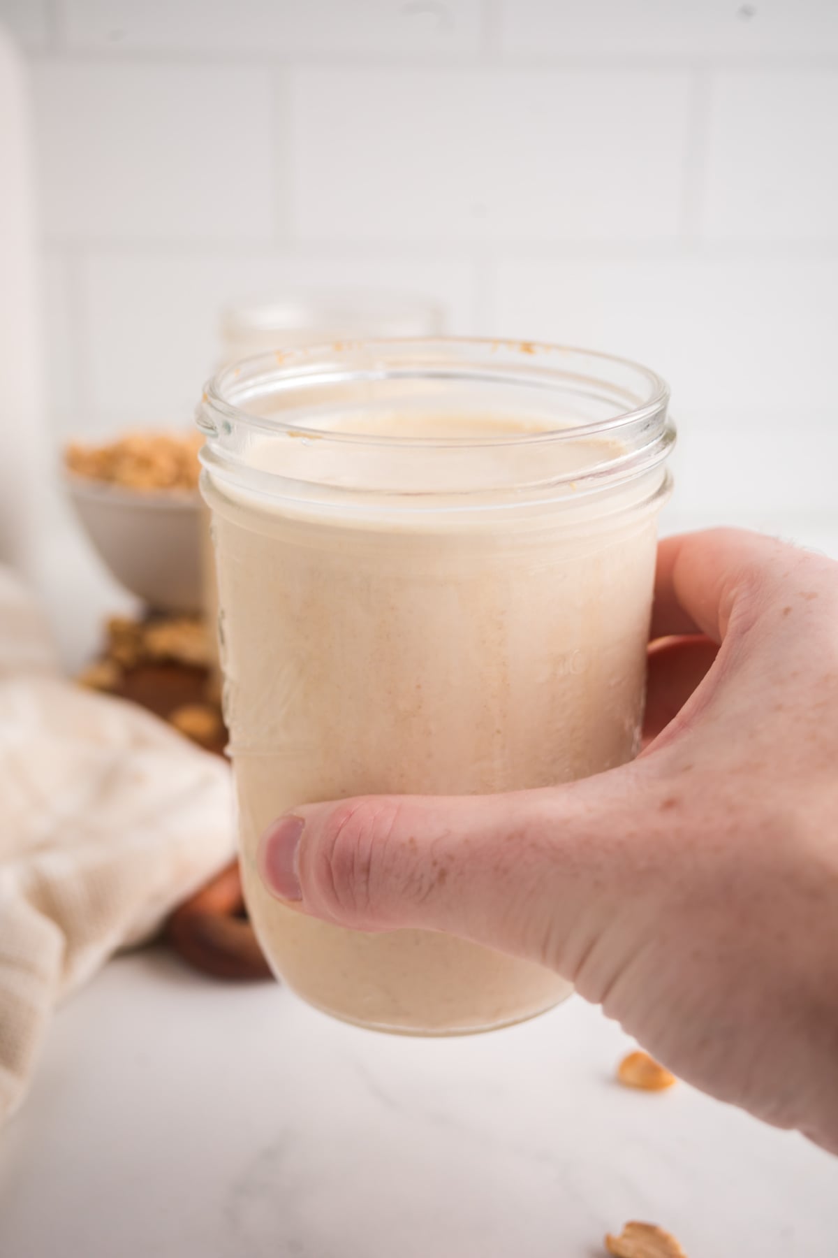 A milkshake held in the air.