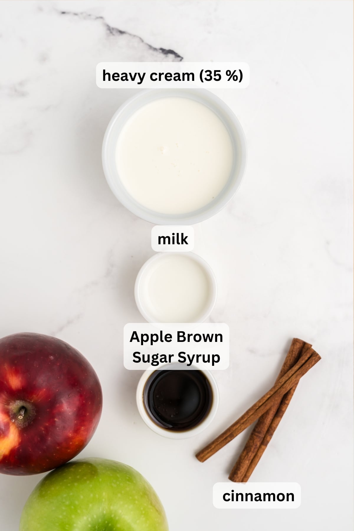 All of the ingredients needed to make Apple Crisp Cold Foam in bowls on a table.