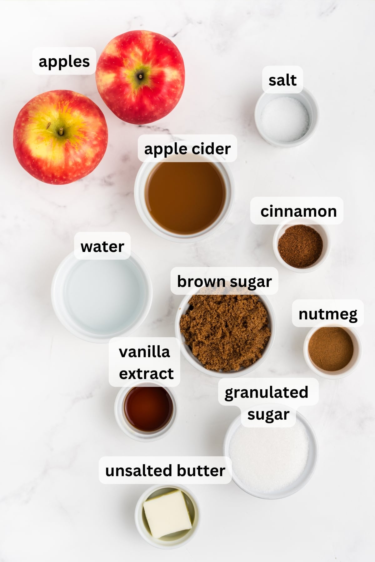 All of the ingredients needed to make Apple Syrup in bowls on a table.