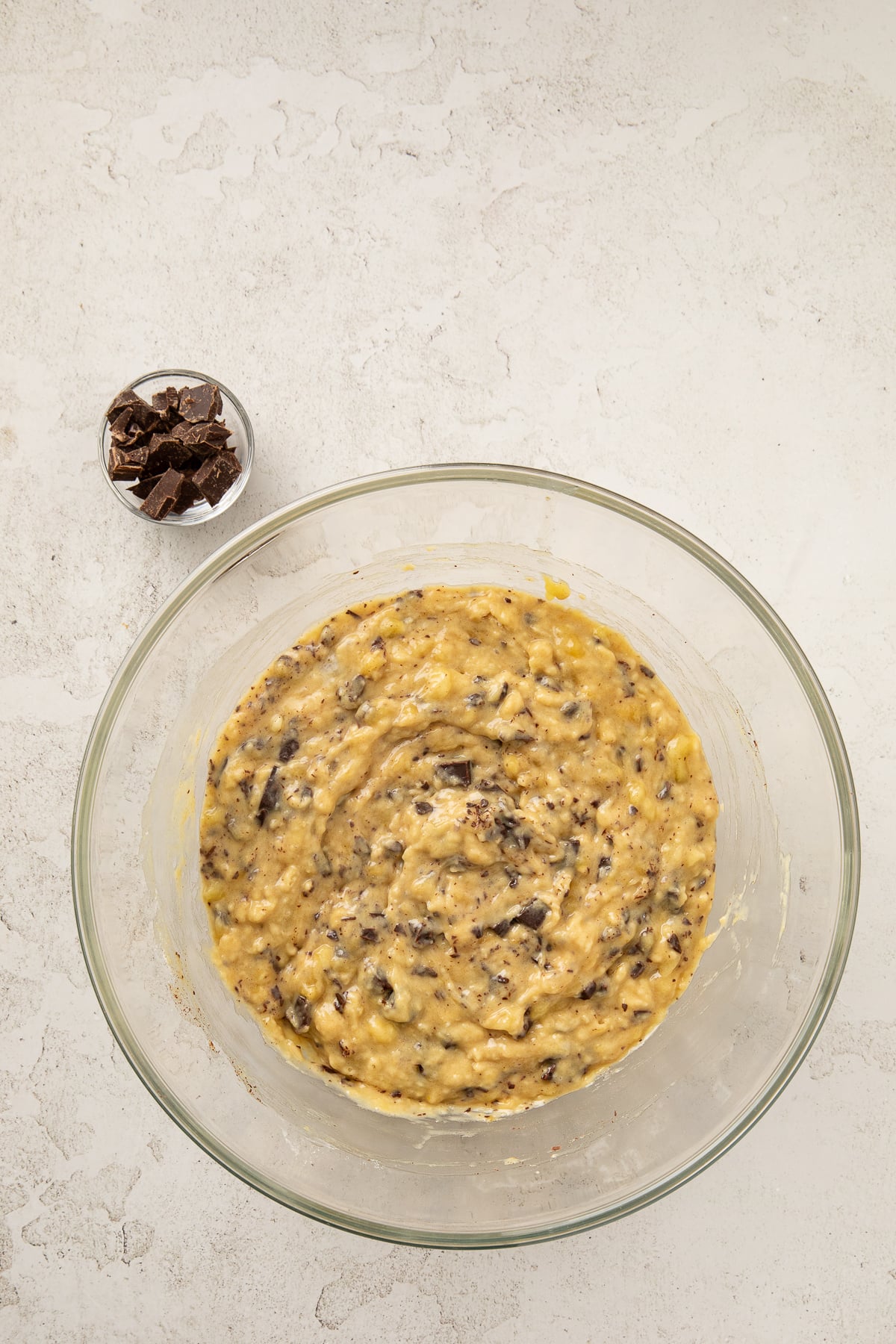 Dry ingredients and chopped chocolate folded into banana bread batter.