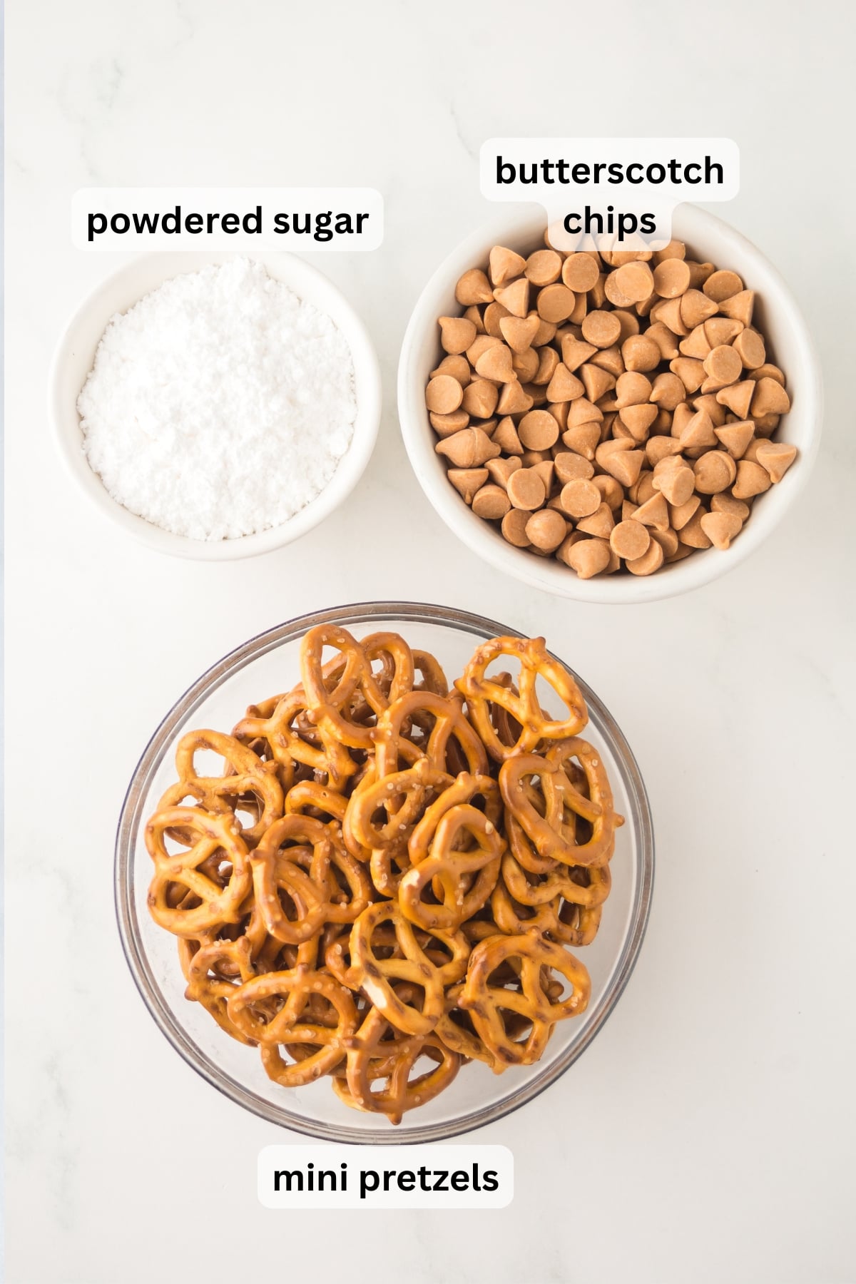 All of the ingredients needed to make Butterscotch Pretzels in bowls on a table.