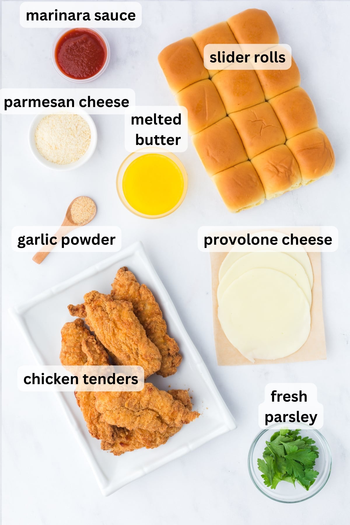 All of the Ingredients needed to make homemade Chicken Parmesan Sliders on a table.