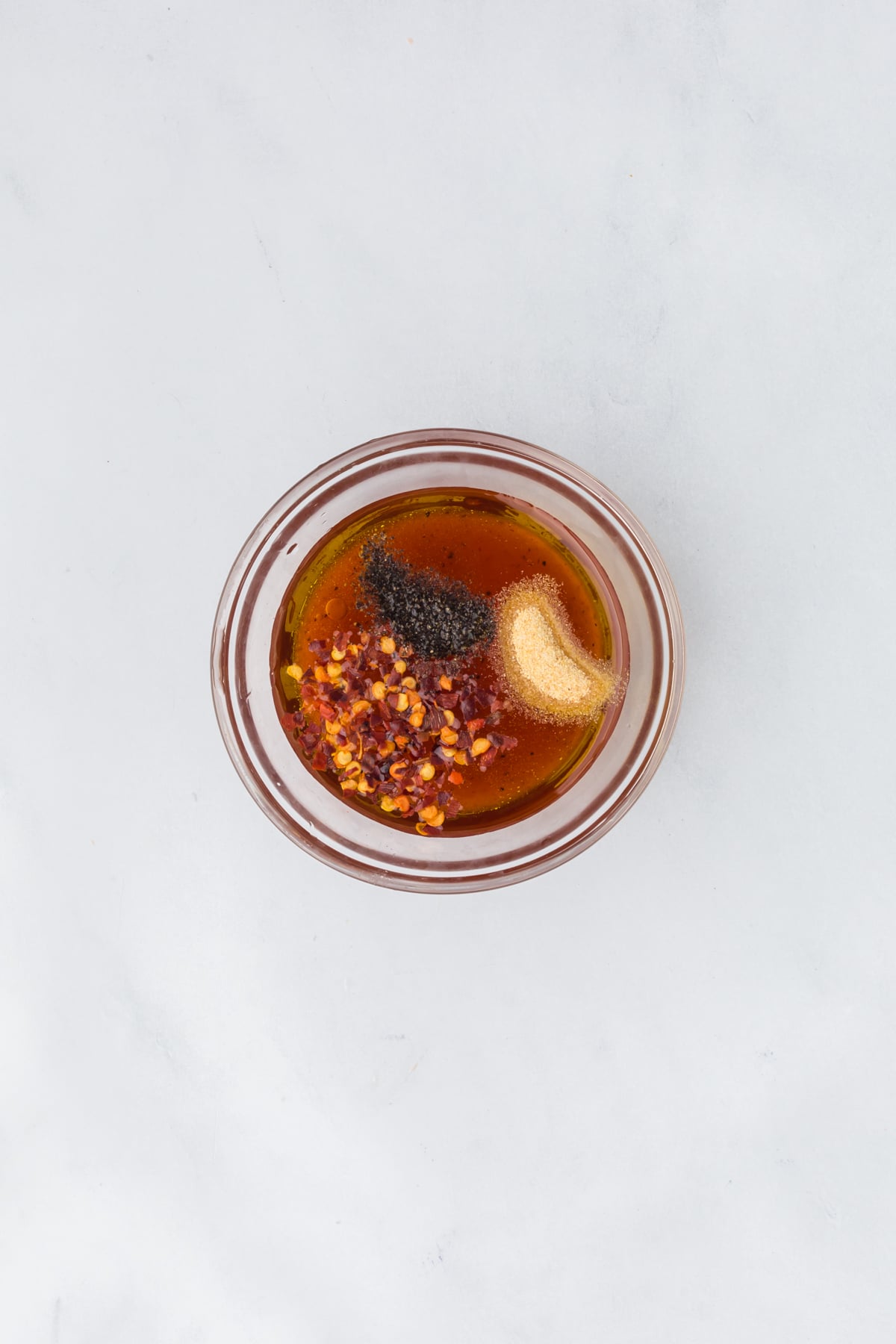 Hot honey glaze ingredients in a bowl.