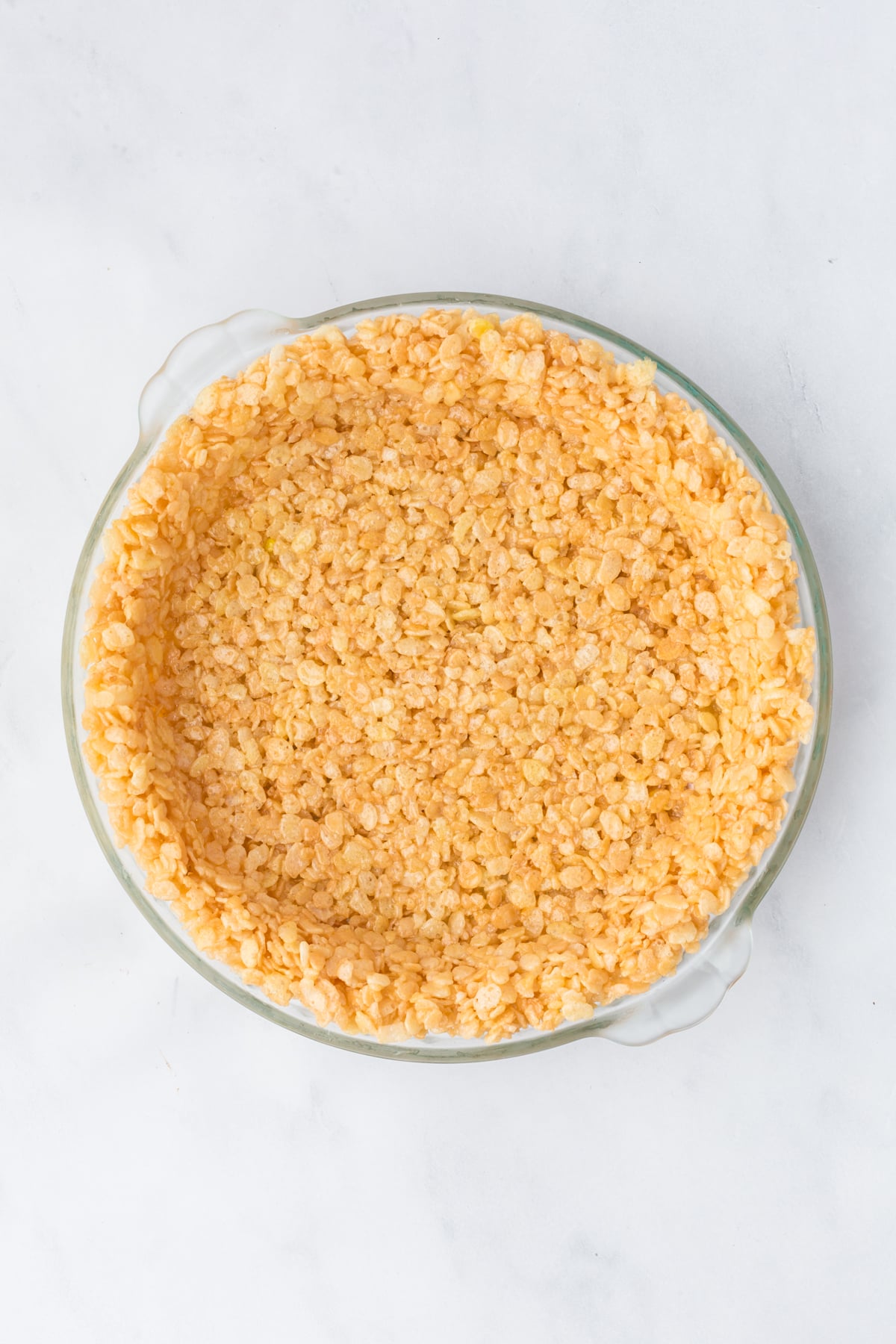 Cereal mixture pressed into pie plate.