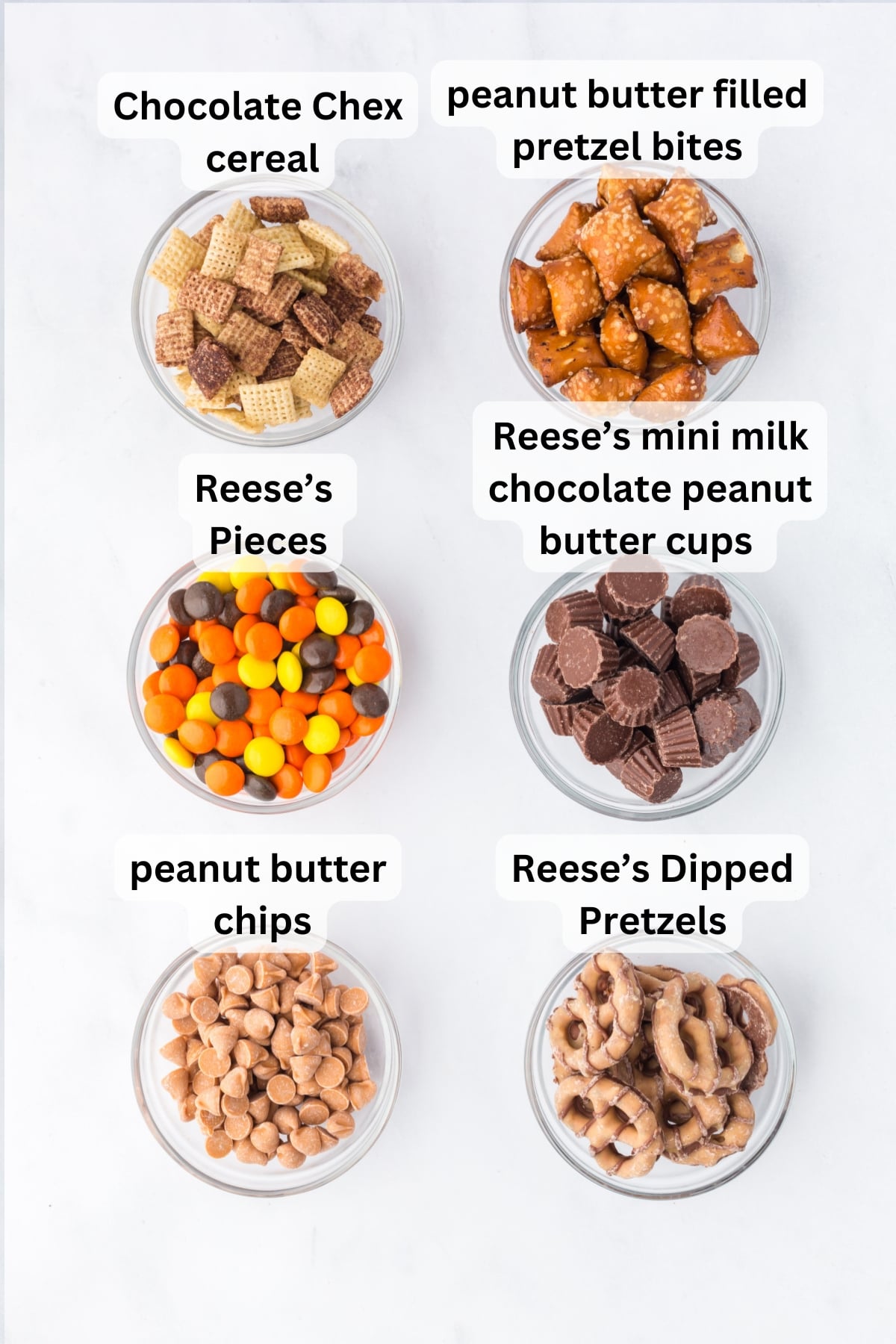 Peanut Butter Trail Mix in bowls on a table.