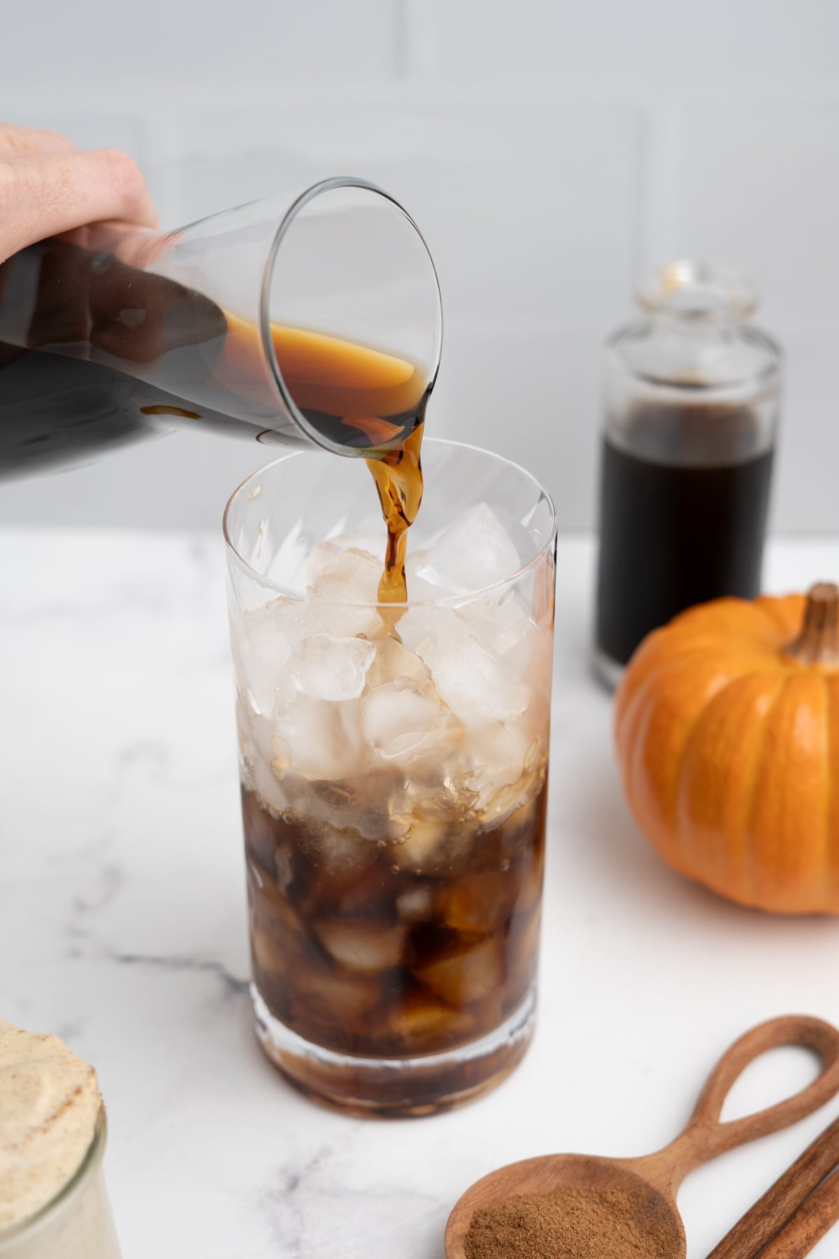 Cold brew poured in a glass full of ice.