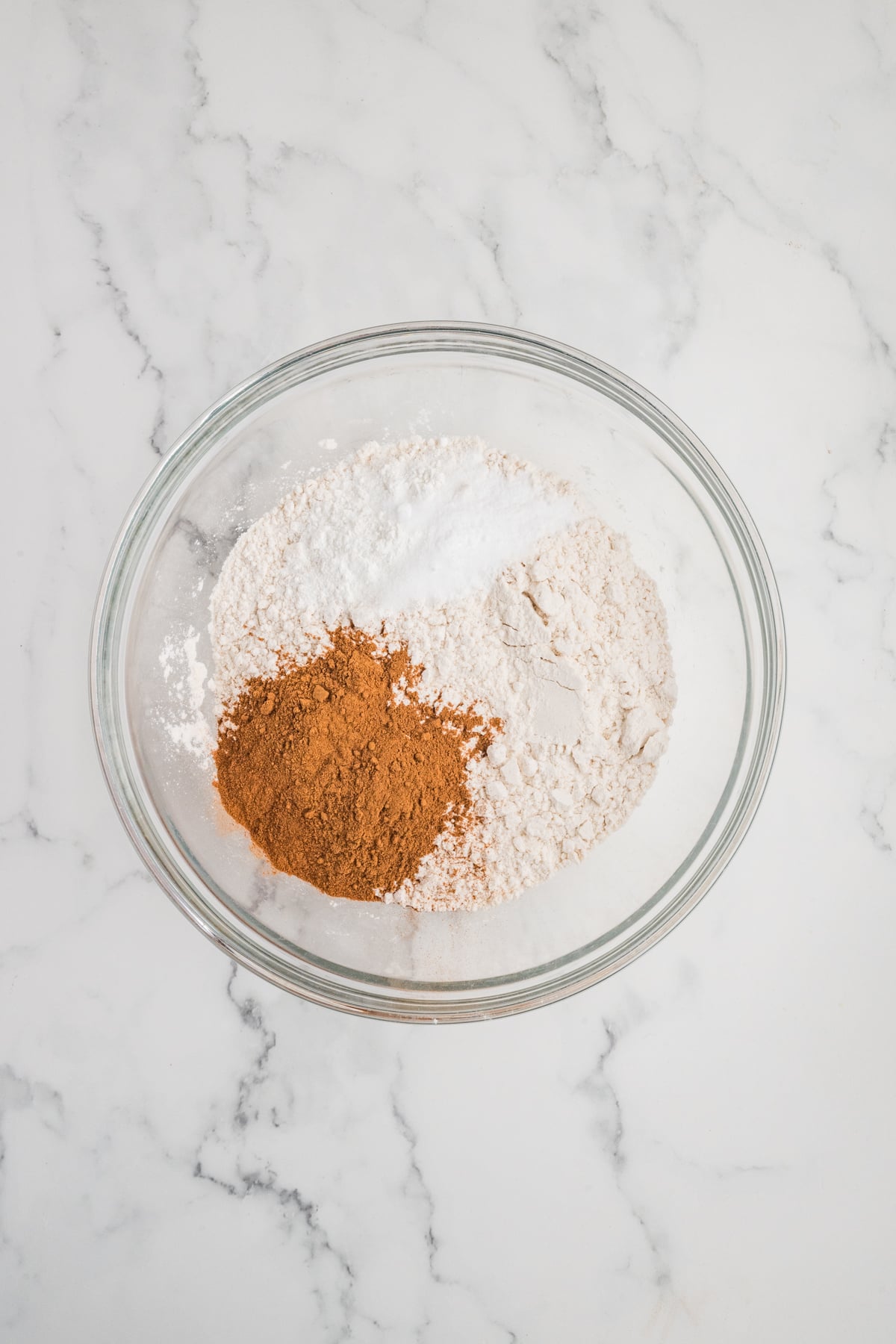 All of the dry ingredients in a mixing bowl.