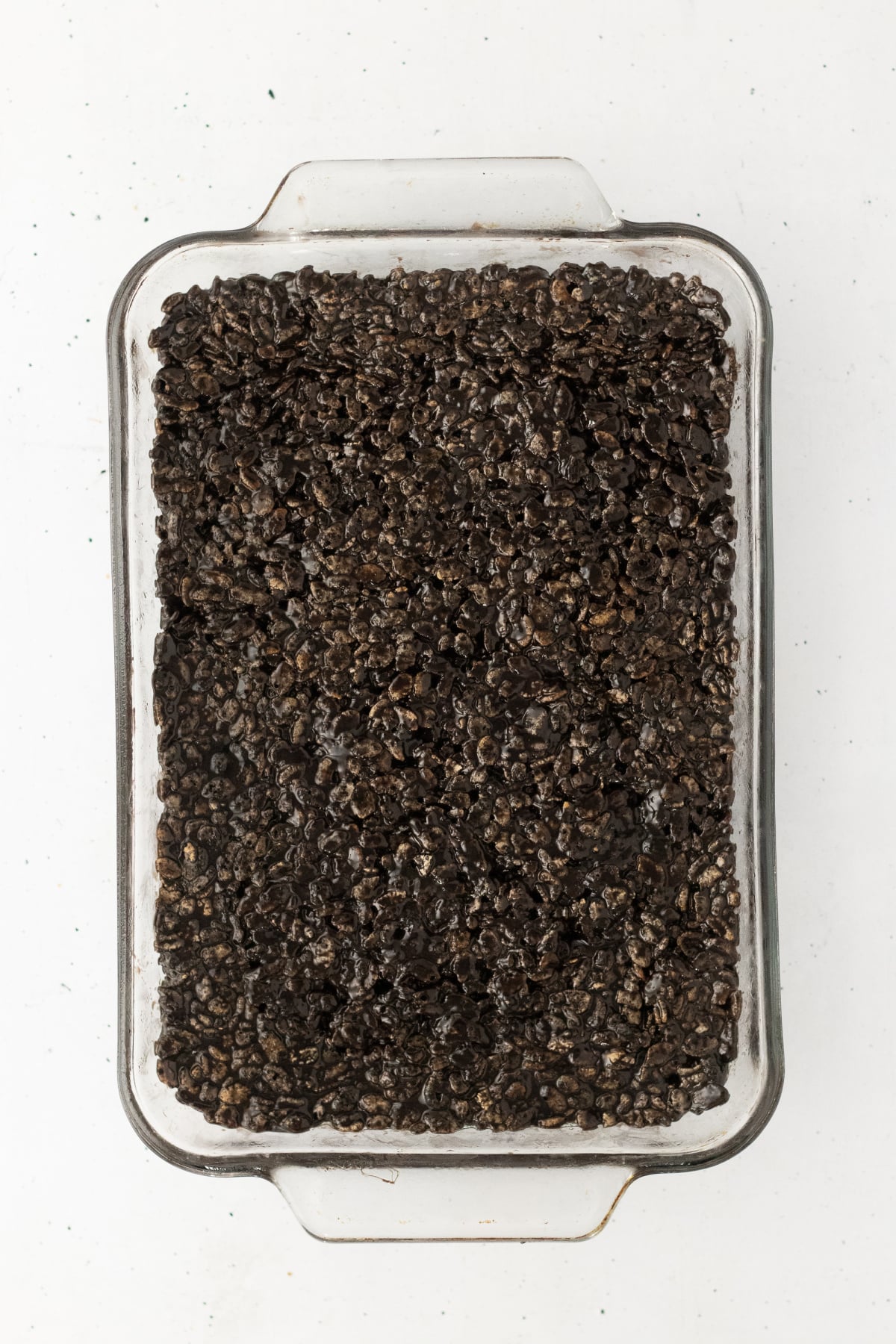 Cereal mixture pressed into baking dish.