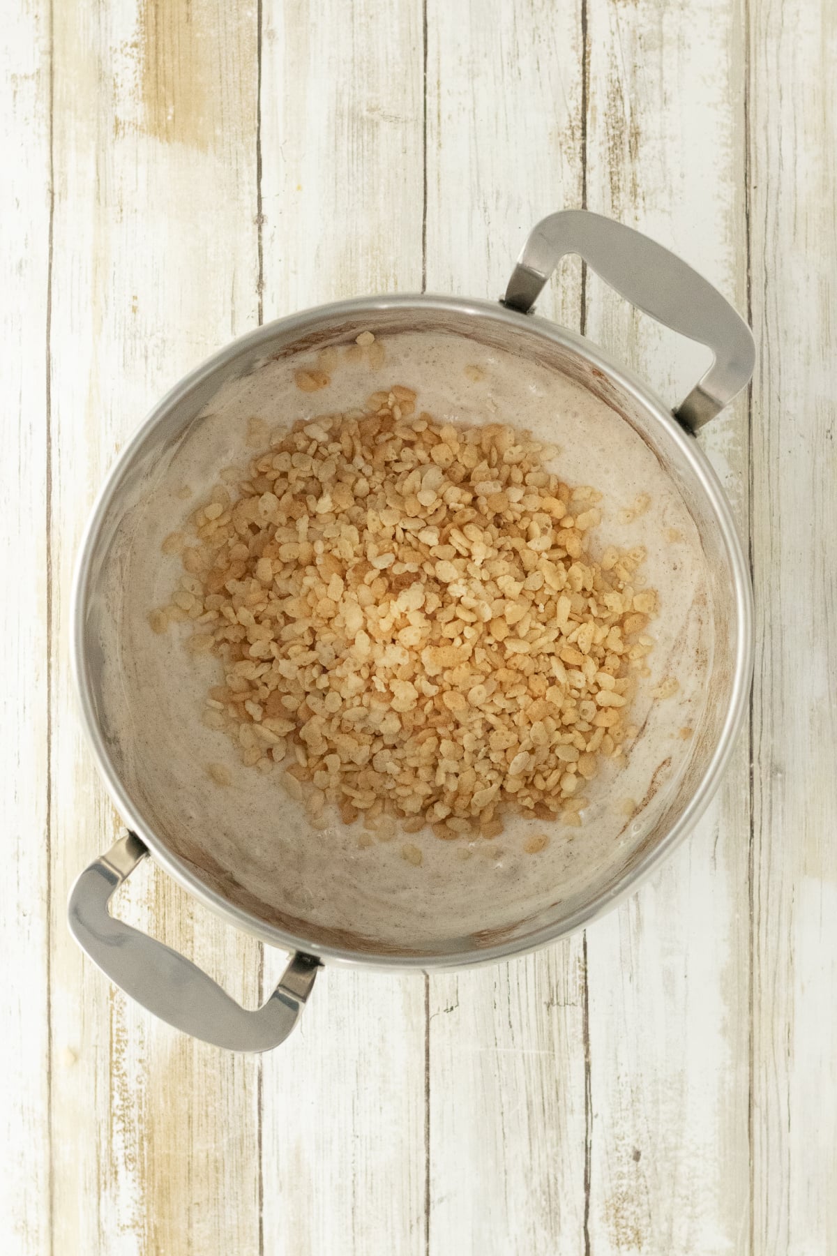 Cereal added to marshmallow mixture.