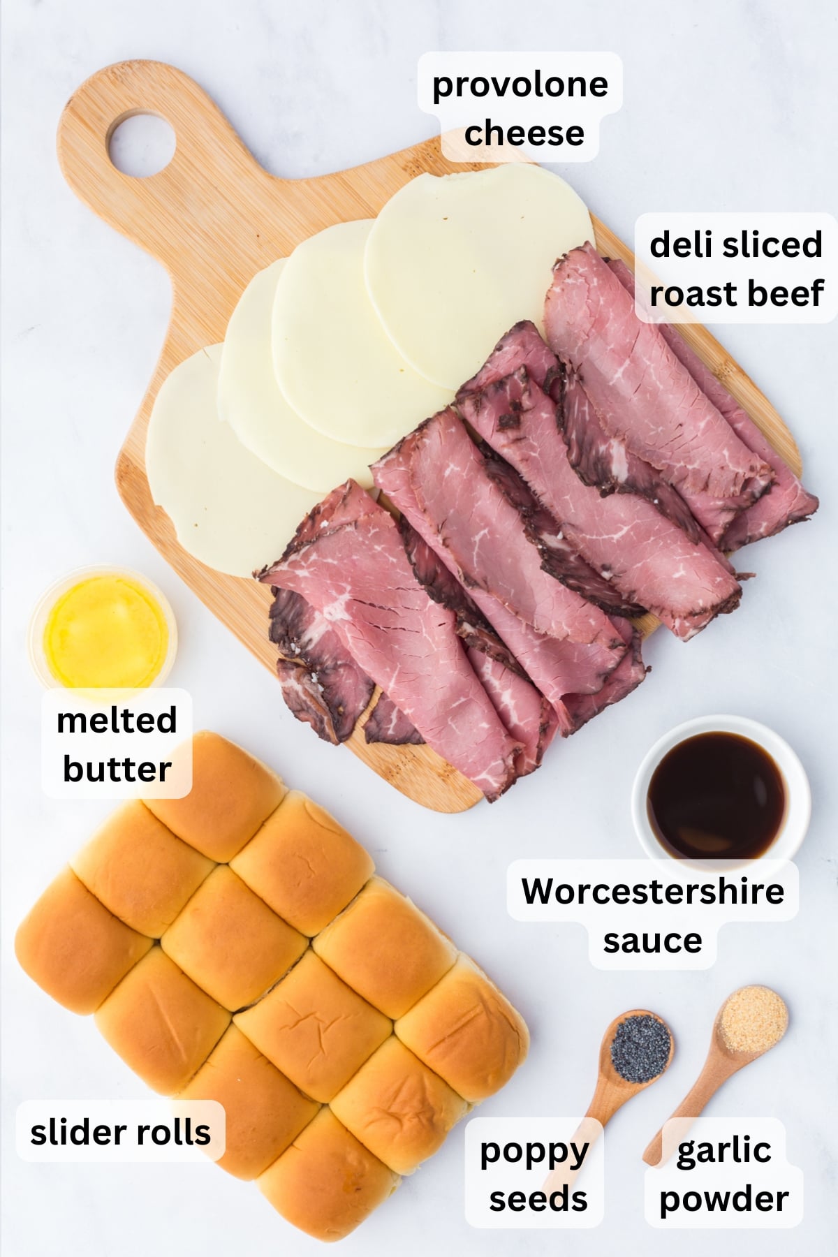 All of the ingredients needed to make Roast Beef Sliders on a table.