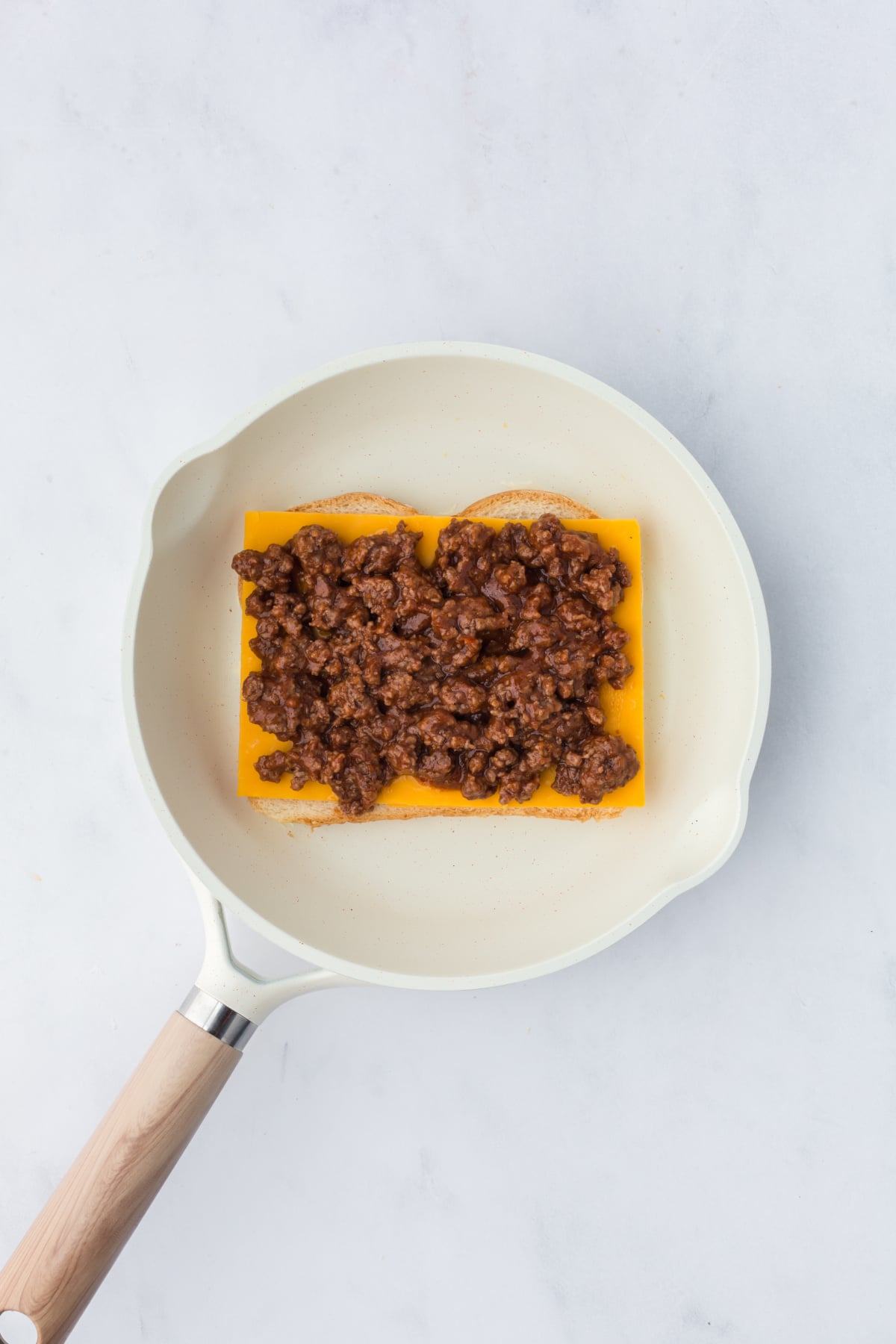 Sloppy joe mixture on top of cheese.