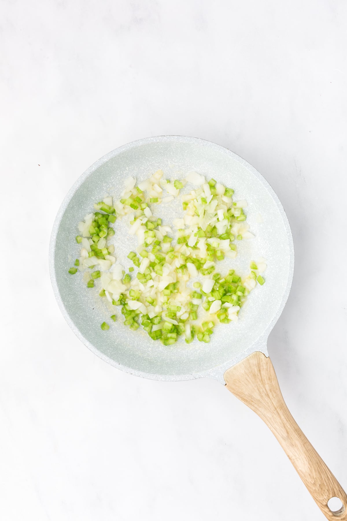 Onion and celery cooking in butter.