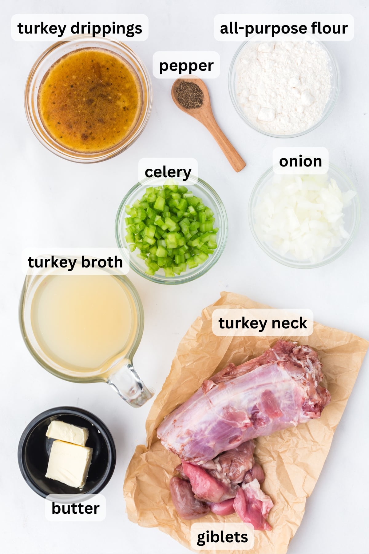 Ingredients needed to make turkey neck gravy in bowls on a table.