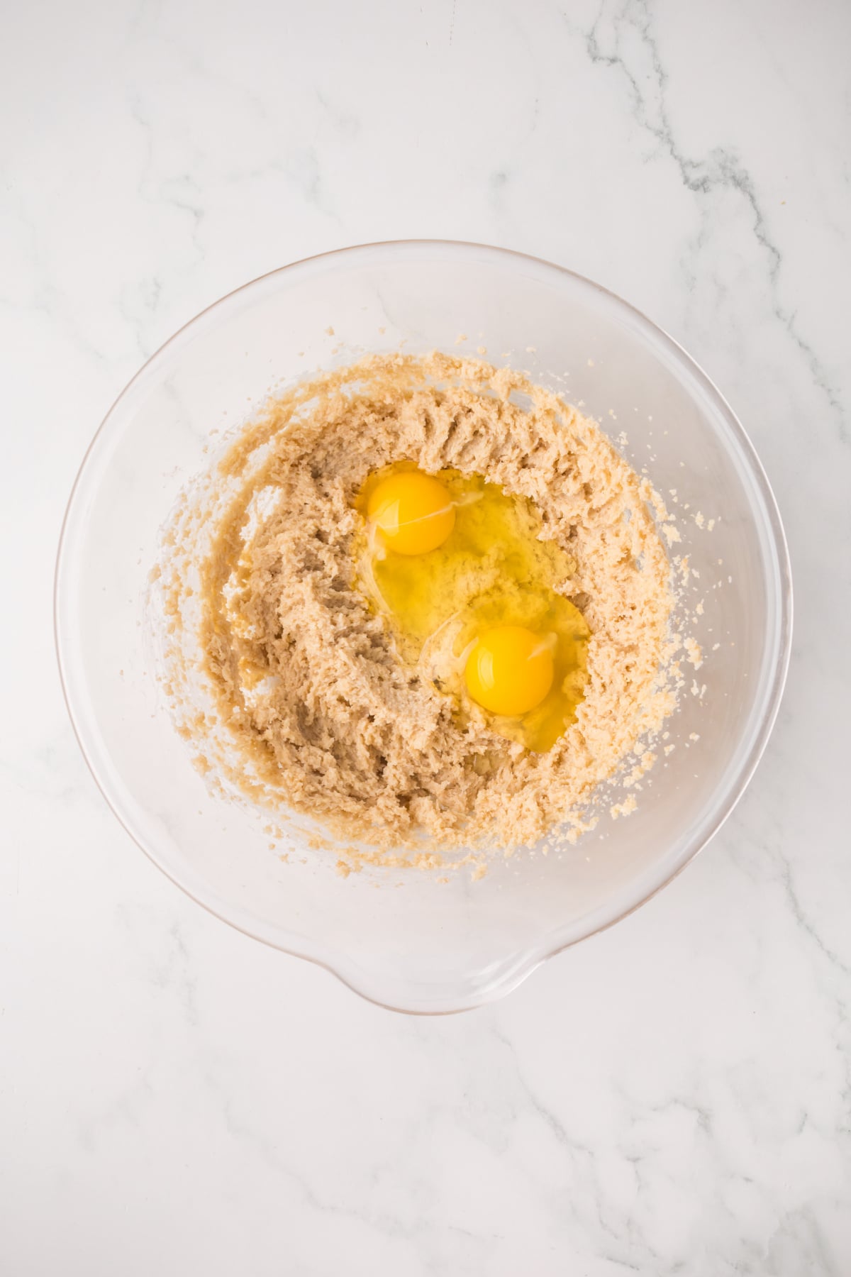 Butter, egg and sugar beaten in a bowl.