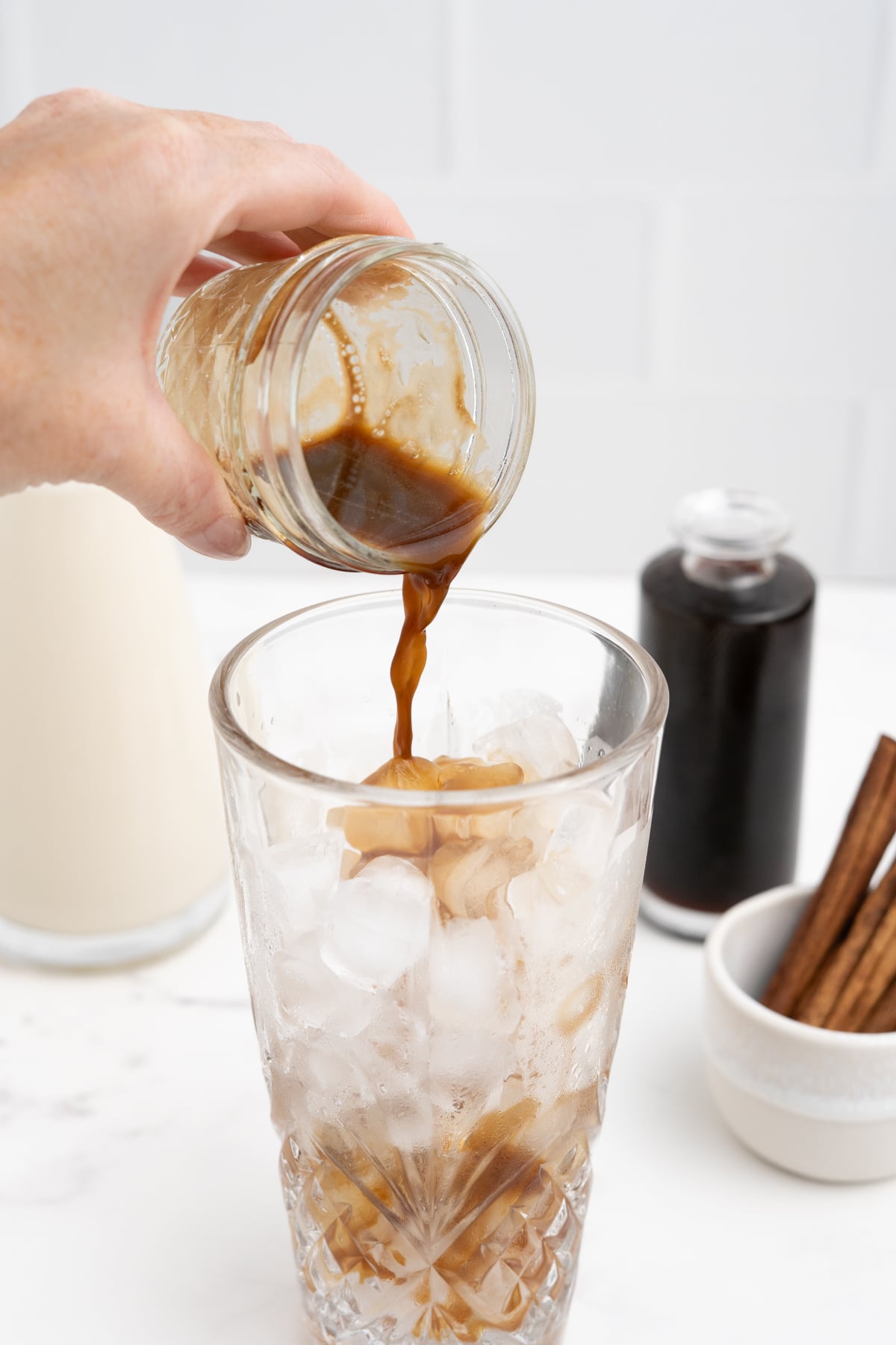 Blonde espresso is added to ice filled glass.