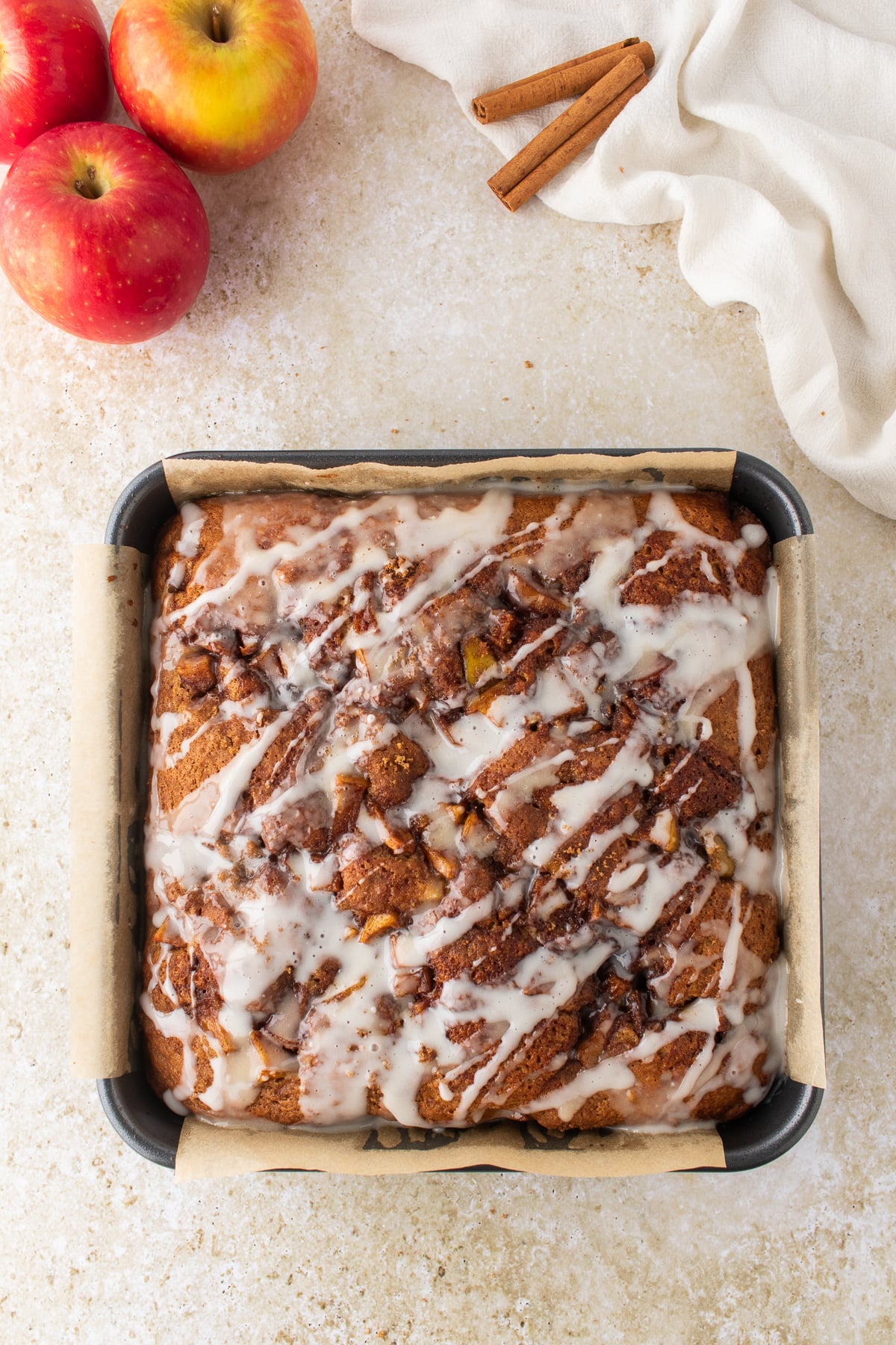 Vanilla glaze drizzled over warm cake.