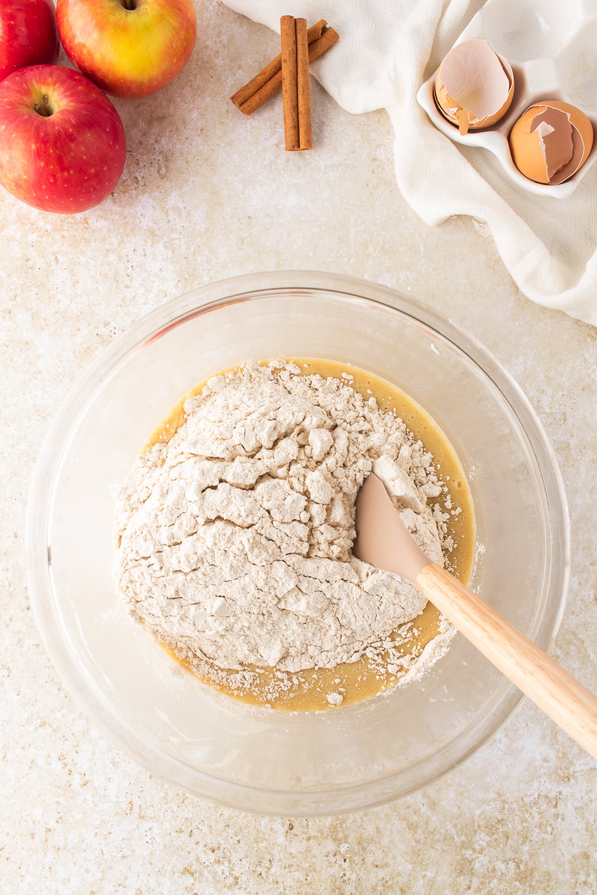 Cake batter being mixed in a large bowl.