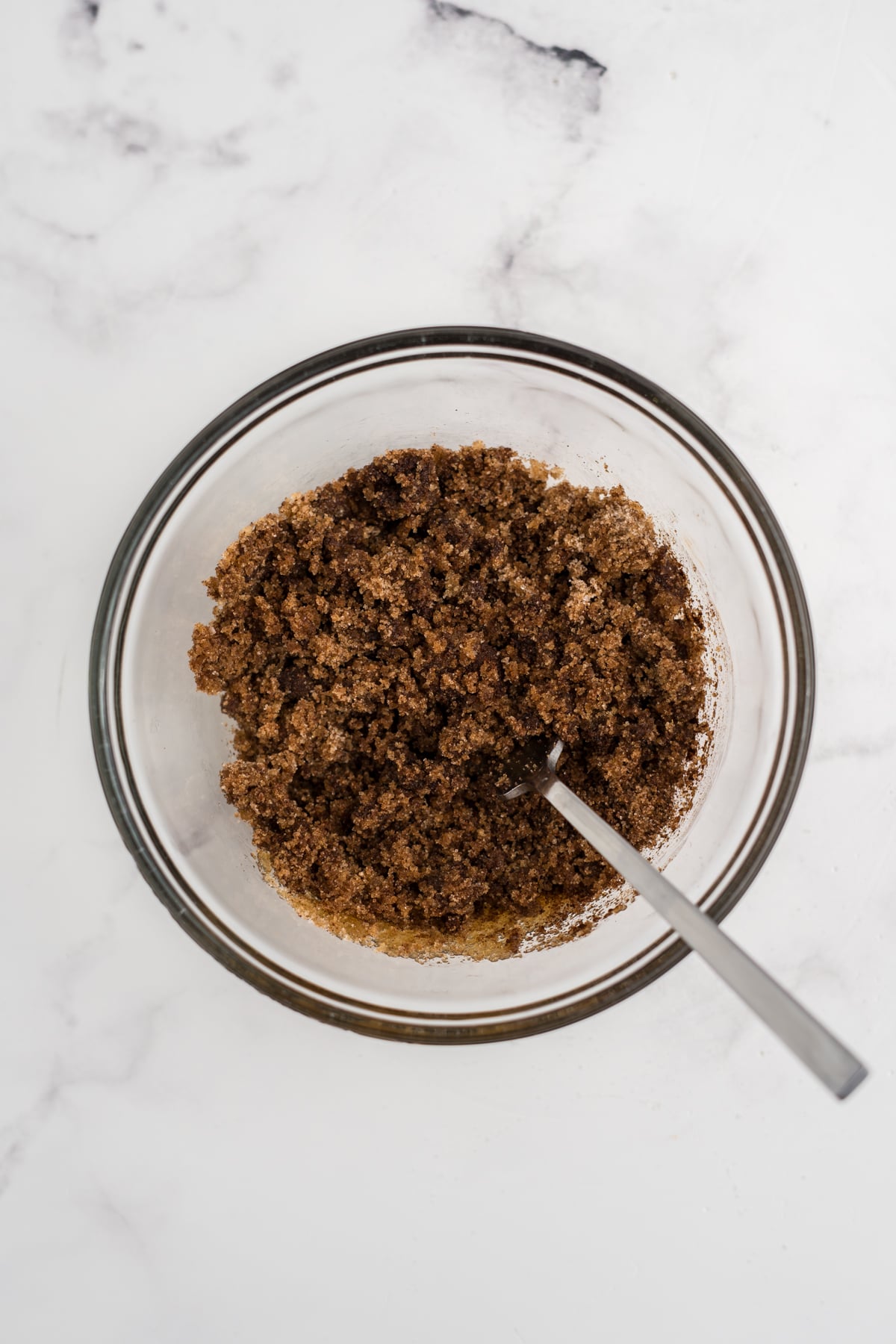 Cinnamon sugar filling mixed in bowl until it resembles damp sand.