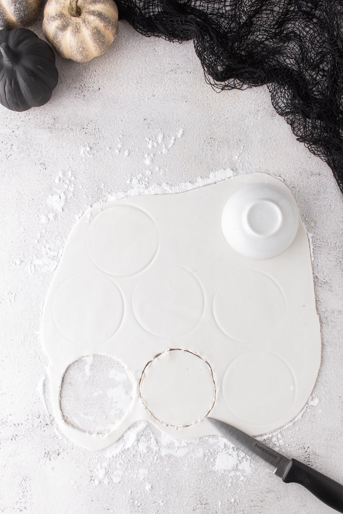 White fondant rolled thin and cut into circles for ghost cloaks.